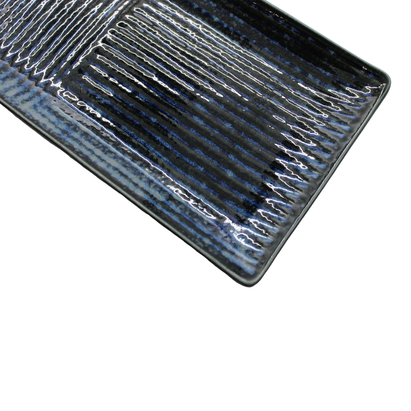 Sashimi Plate - Lined Indigo Blue: rectangular ceramic serving plate with glossy indigo blue glaze and striped pattern, displayed at an angle on a white background.