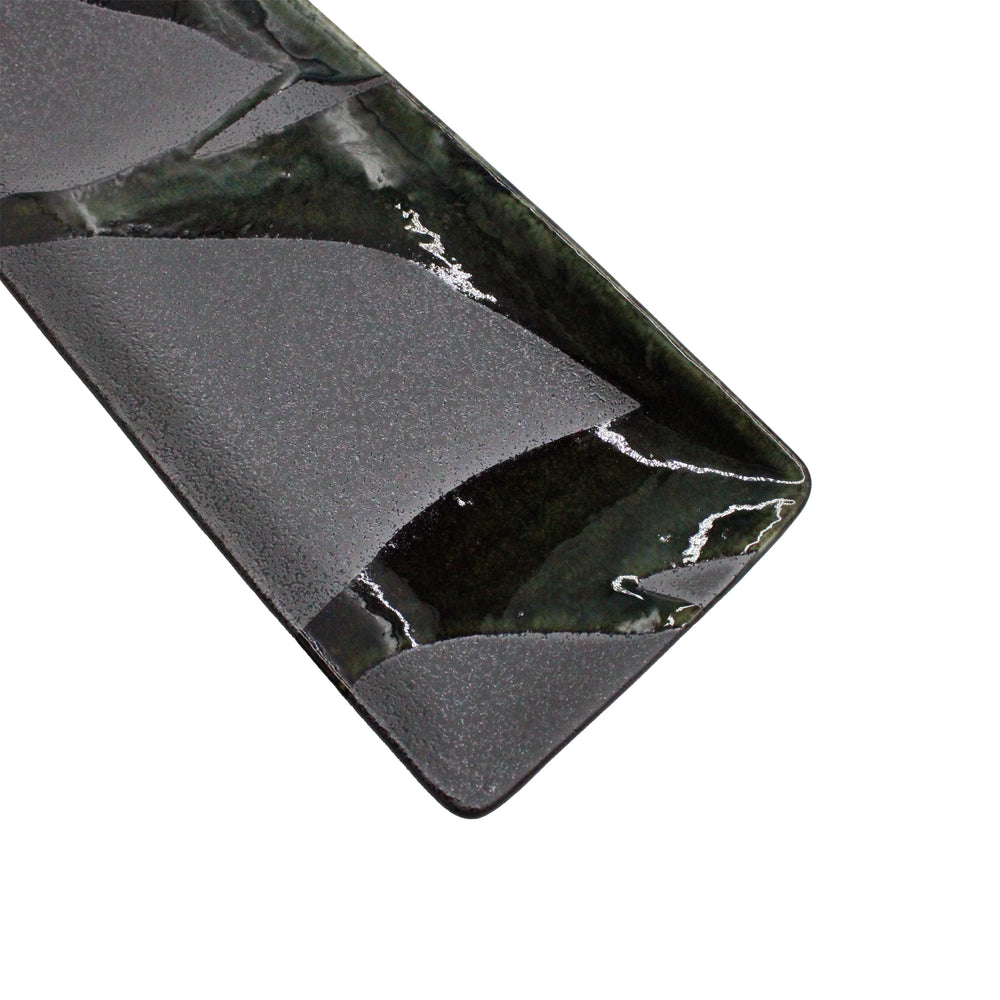 
                  
                    The Sashimi Platter - Mino Craft Green and Grey is a rectangular ceramic dish featuring a glossy green and grey abstract glaze, bringing an artisanal wabi-sabi touch to your table setting.
                  
                