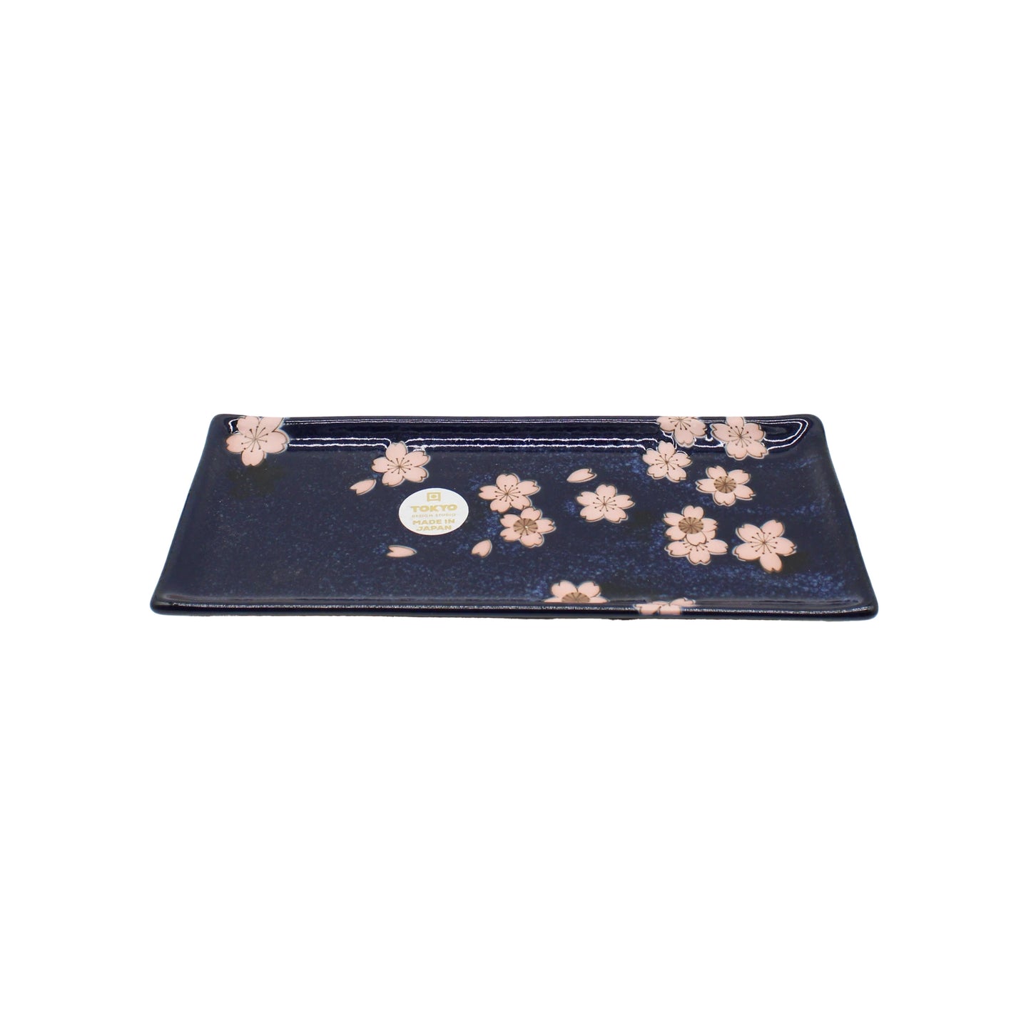 The Sashimi Platter - Navy & Pink Sakura Blossom is a rectangular Japanese ceramic platter featuring pink cherry blossom designs and a small round label on one side, shown against a white background.