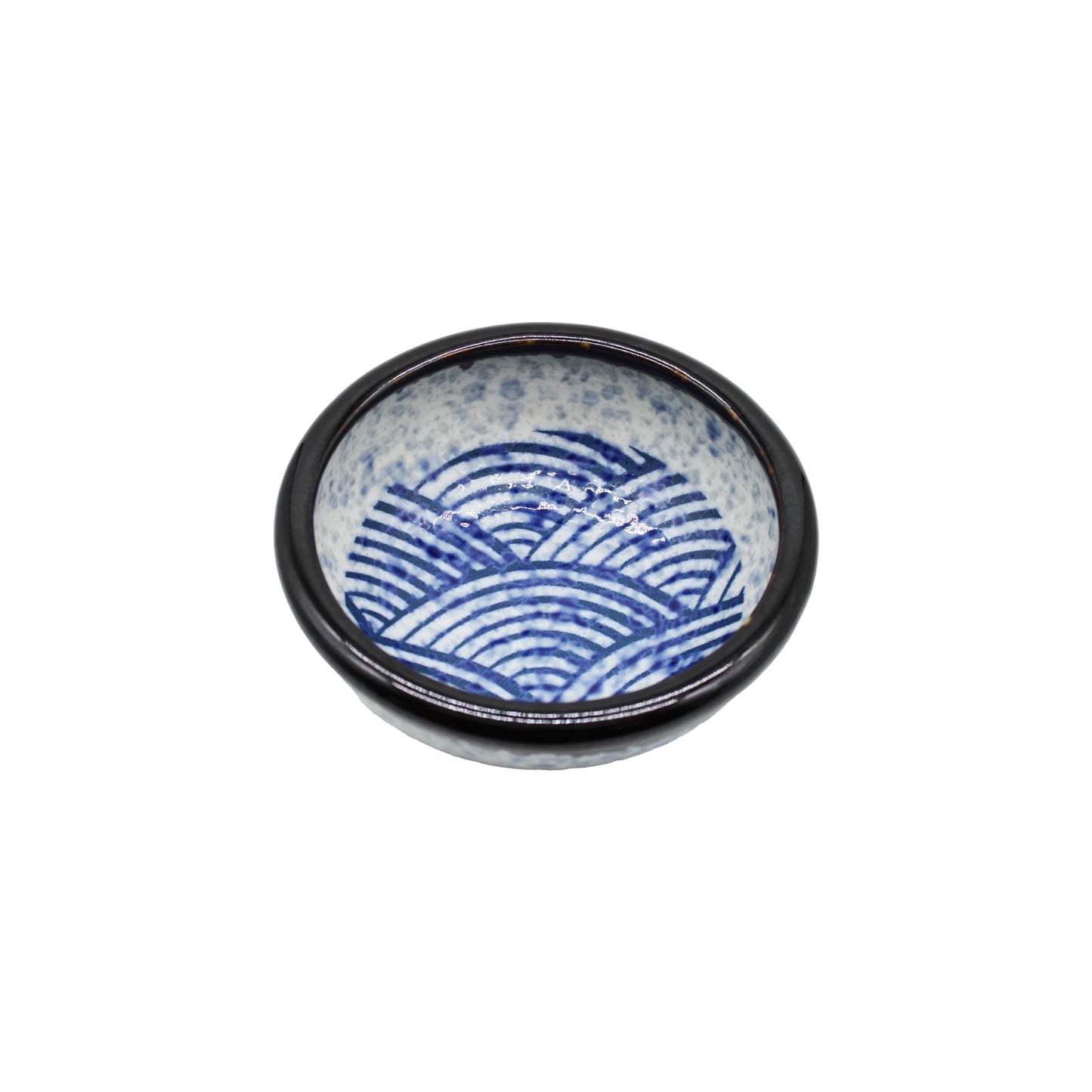 
                  
                    The Soy Sauce Dish - Japanese Wave is a small Japanese ceramic bowl with a dark rim and a striking blue seigaiha wave pattern inside on a white background.
                  
                