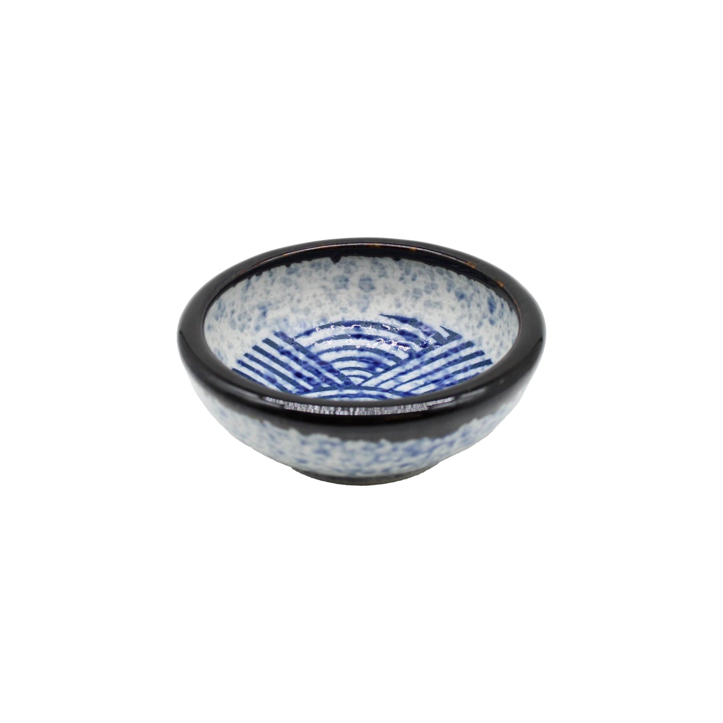 The Soy Sauce Dish - Japanese Wave is a small Japanese ceramic bowl with a blue seigaiha wave pattern inside and a dark rim, perfect for serving sauces.
