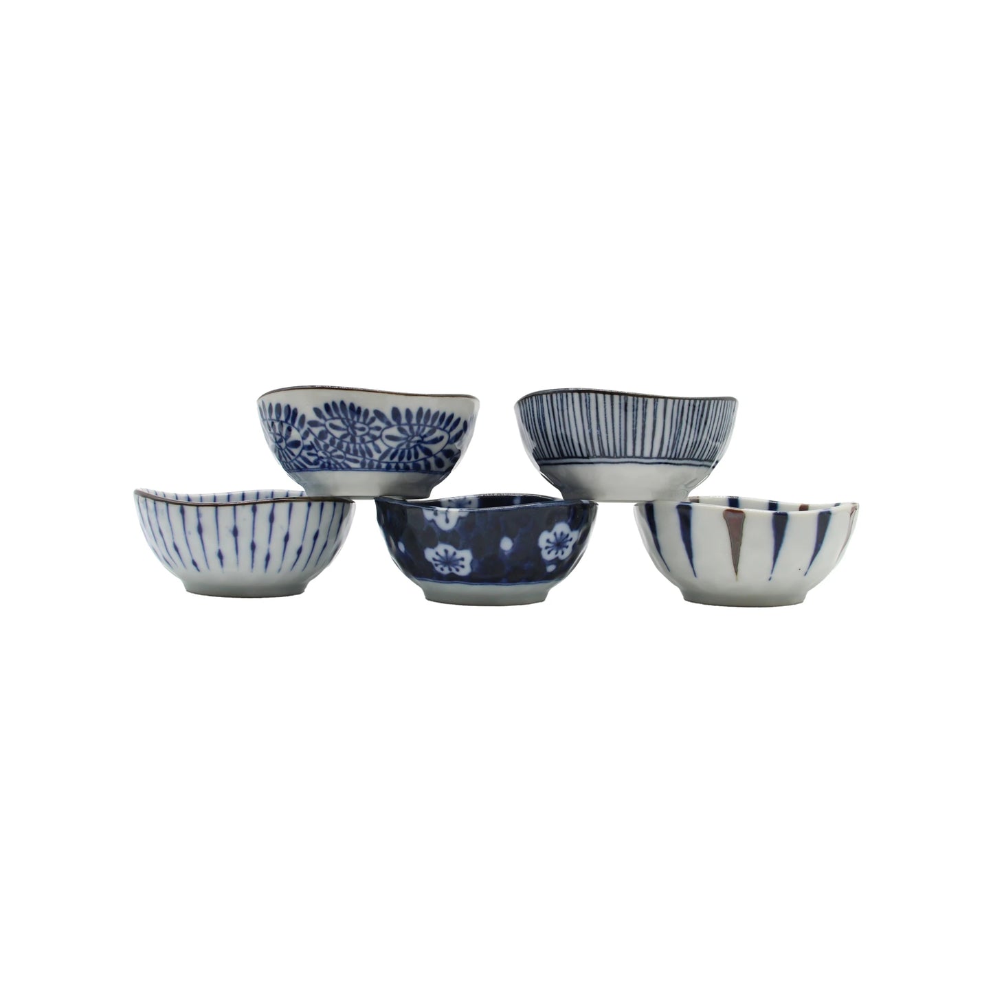 
                  
                    Five small Japanese porcelain sauce dishes from the 5 Piece Japanese Sauce Dish Set - Aizome, featuring unique indigo blue patterns and arranged in a staggered formation.
                  
                
