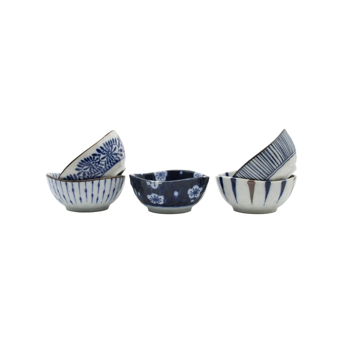 Five small 5 Piece Japanese Sauce Dish Set - Aizome porcelain sauce dishes featuring indigo blue patterns, arranged in stacks.
