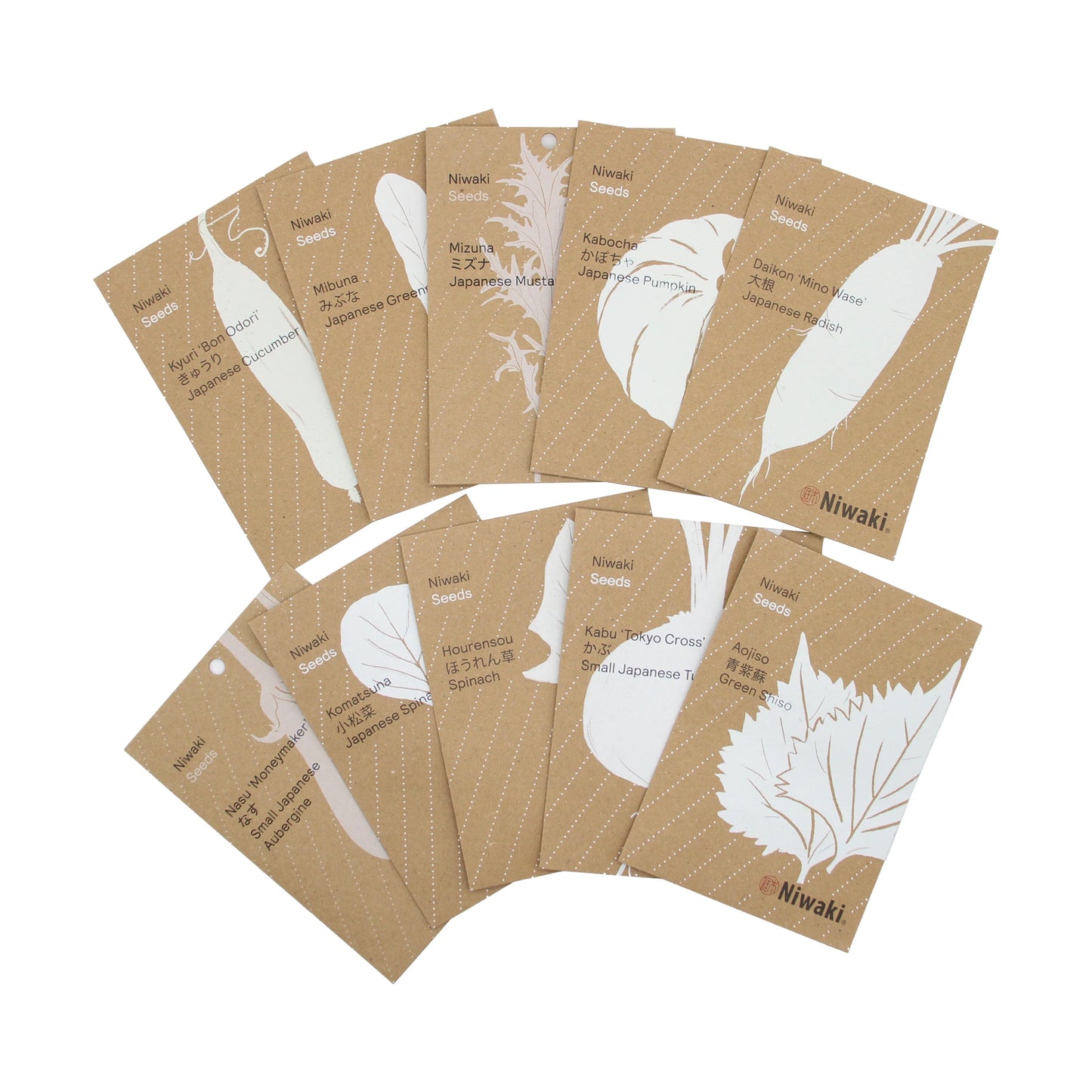 
                  
                    Eight brown Japanese Edible Plant Seed Collection packets, ideal for a kitchen garden, are semi-circled and labeled with white vegetable illustrations.
                  
                