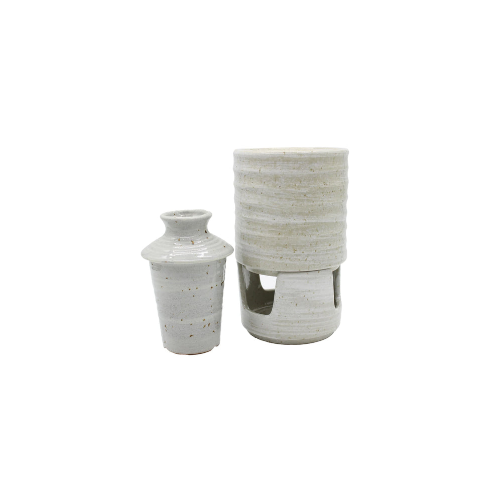 
                  
                    The Ceramic Seiji Sake Warmer includes two white speckled ceramic vessels: a small lidded jar and a taller cylindrical sake holder with an open base—an elegant addition to any sake set.
                  
                