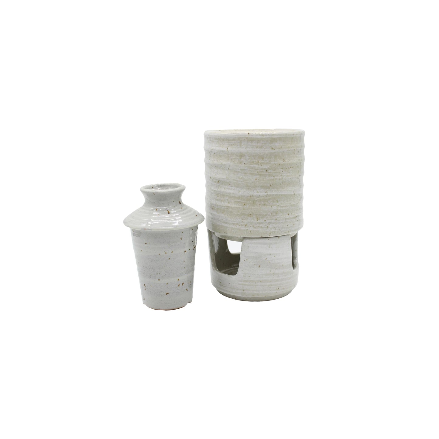 
                  
                    The Ceramic Seiji Sake Warmer includes two white speckled ceramic vessels: a small lidded jar and a taller cylindrical sake holder with an open base—an elegant addition to any sake set.
                  
                