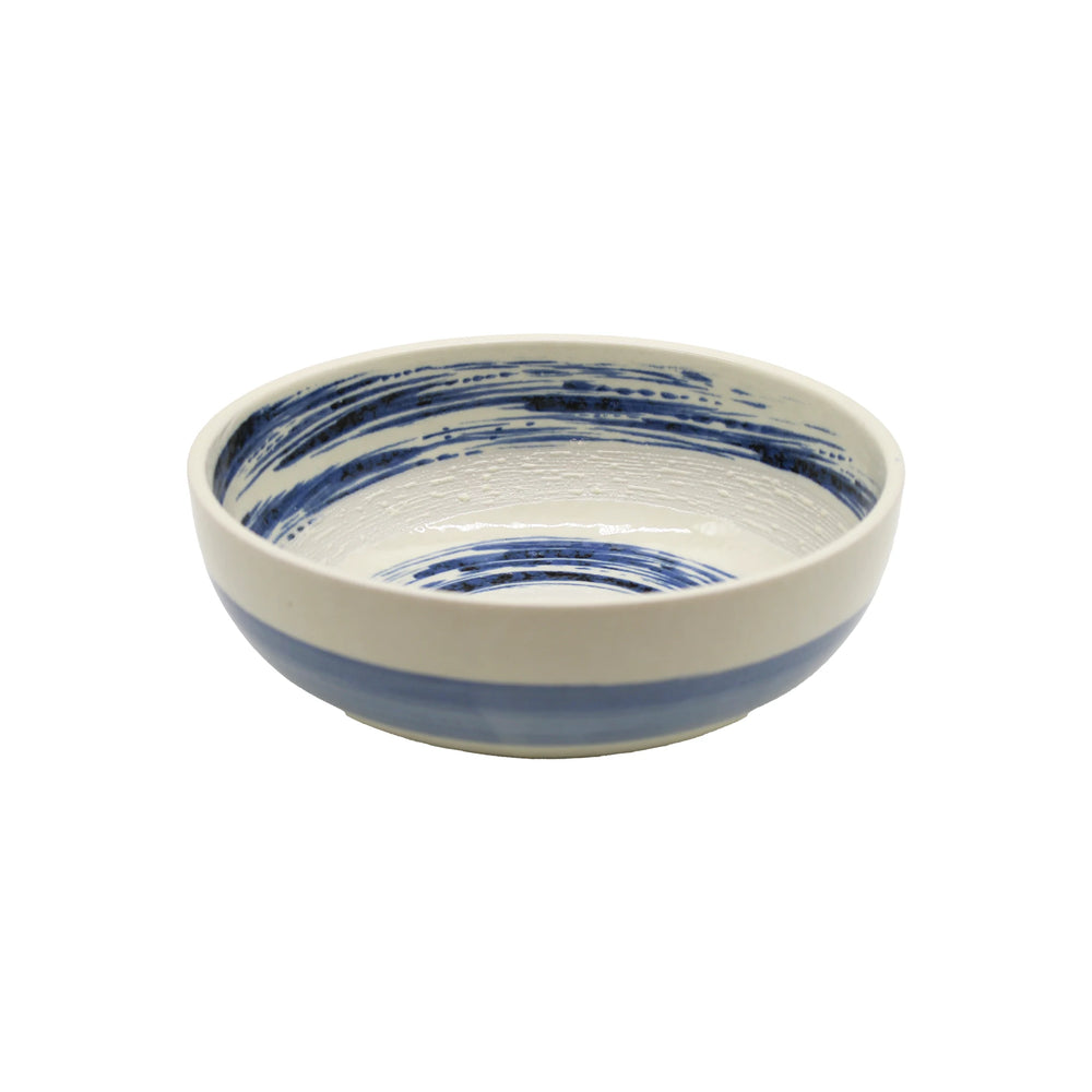 The Open Bowl - Blue Swirl is crafted from Minoyaki porcelain, featuring a white base with blue hand-painted brushstroke patterns both inside and out, displayed on a plain white background.