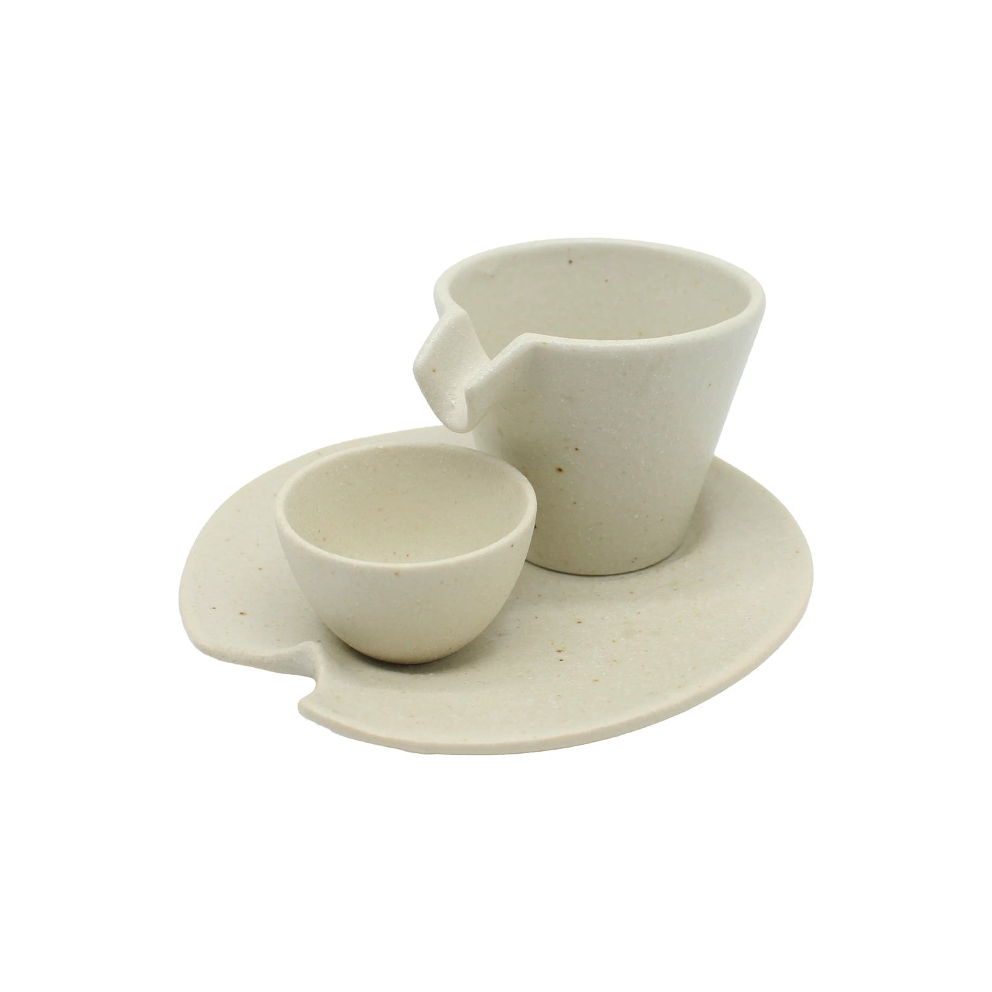 
                  
                    The Shizuru Sake Set features a white ceramic cup and bowl on a matching plate, all with minimalist modern design and subtle edge notches—crafted in the style of Kaneko Ko-hyo pottery, evoking traditional Japanese sake ware.
                  
                