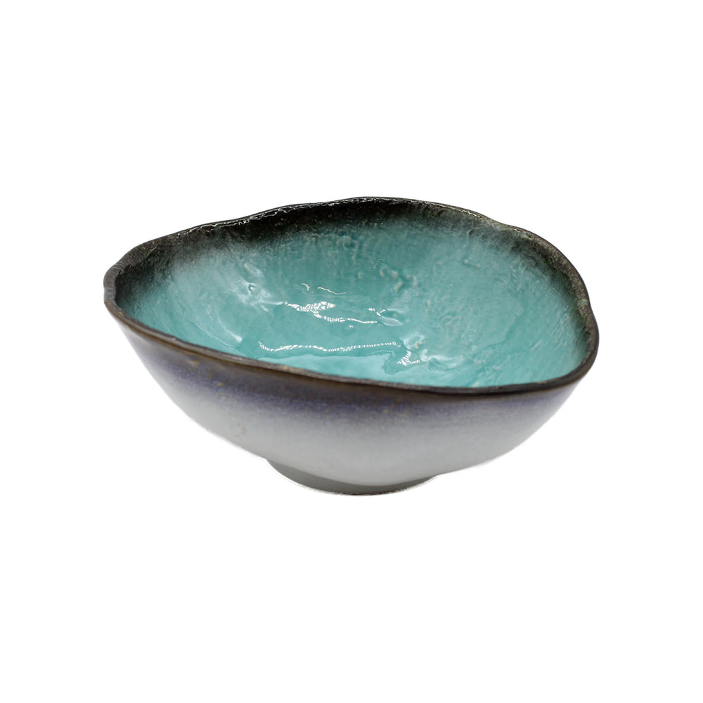 The Large Uneven Bowl - Sky Blue is a Minoyaki porcelain piece from Gifu, featuring a wavy rim, dark brown-to-turquoise gradient glaze inside, and a sky blue exterior.