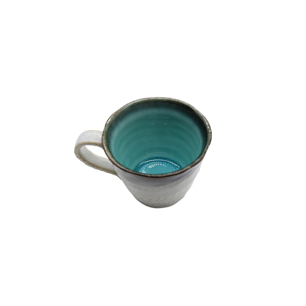 The Mug with Handle - Sky Blue is a Minoyaki porcelain mug featuring a white exterior and sky blue glazed interior, shown from above against a white background.