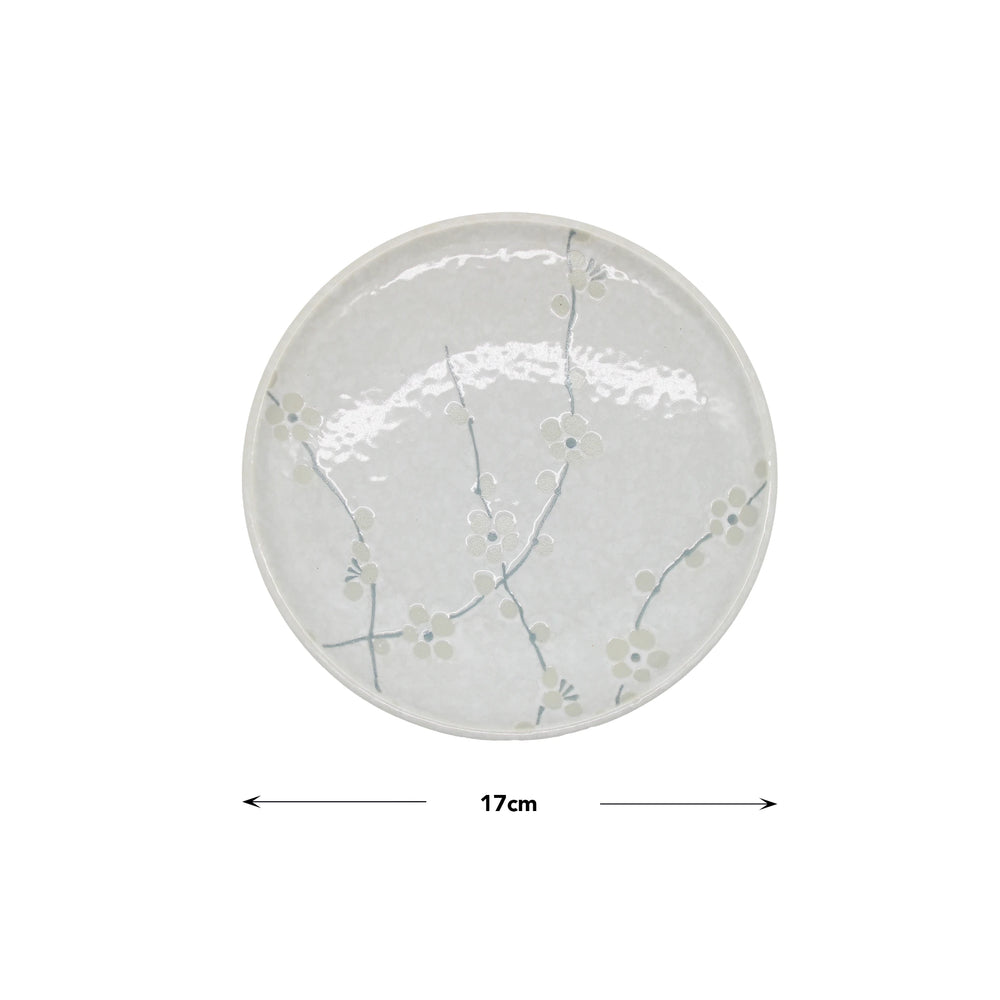 The Small Plate - White Blossom is a round Japanese porcelain plate with a subtle cherry blossom design, measuring 17 cm in diameter.