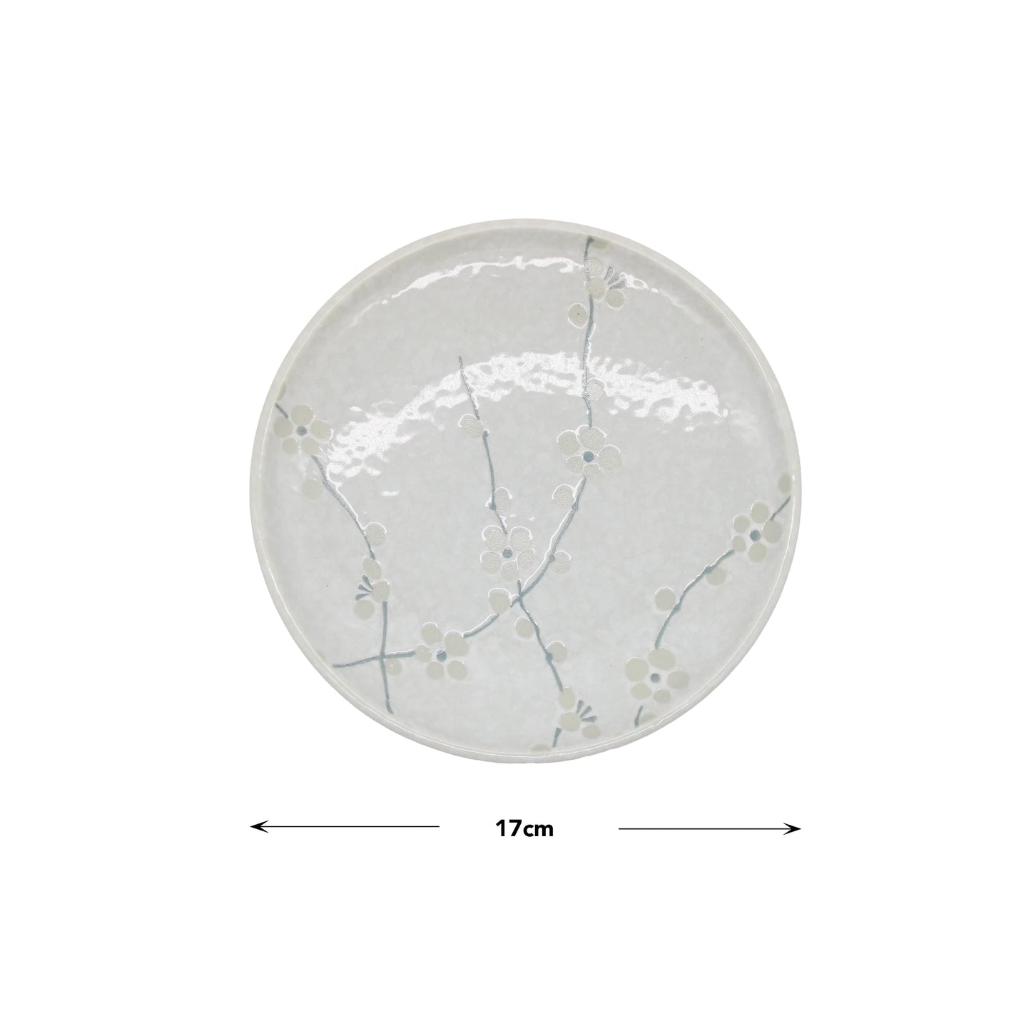 The Small Plate - White Blossom is a round Japanese porcelain plate with a subtle cherry blossom design, measuring 17 cm in diameter.