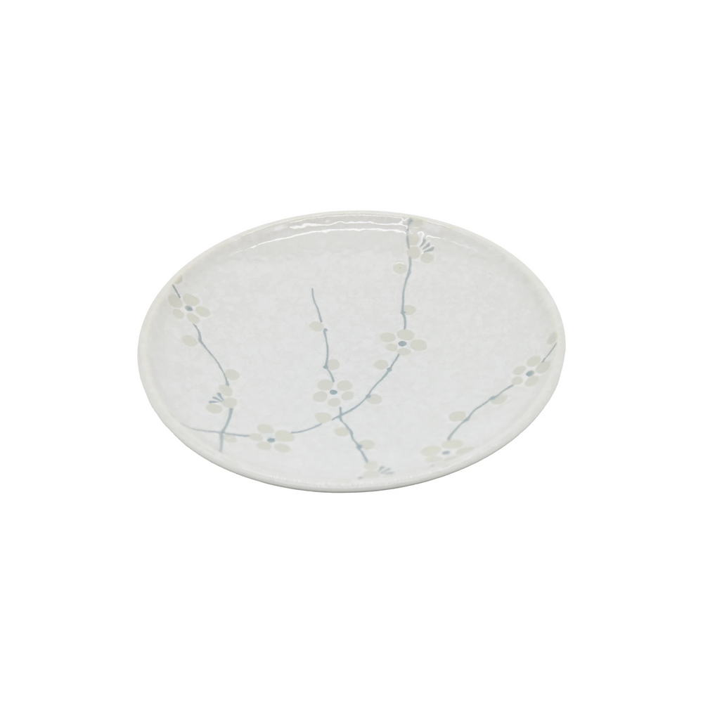The Small Plate - White Blossom is a round Japanese porcelain plate featuring a light blue cherry blossom design around the rim on a white background.