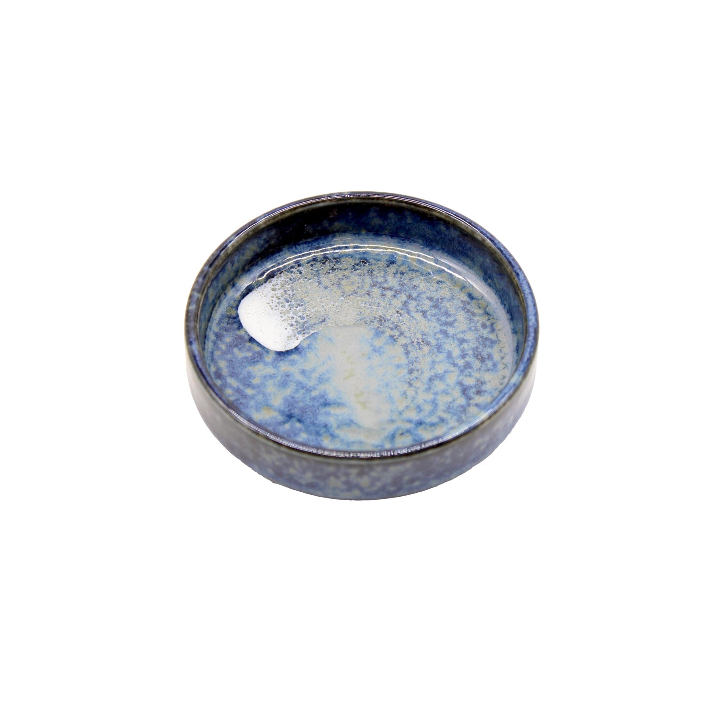 
                  
                    The Soba Seasoning Deep Cup - Blue is a round, shallow ceramic dish with a blue and white speckled glaze, inspired by Japanese pottery and photographed on a white background.
                  
                