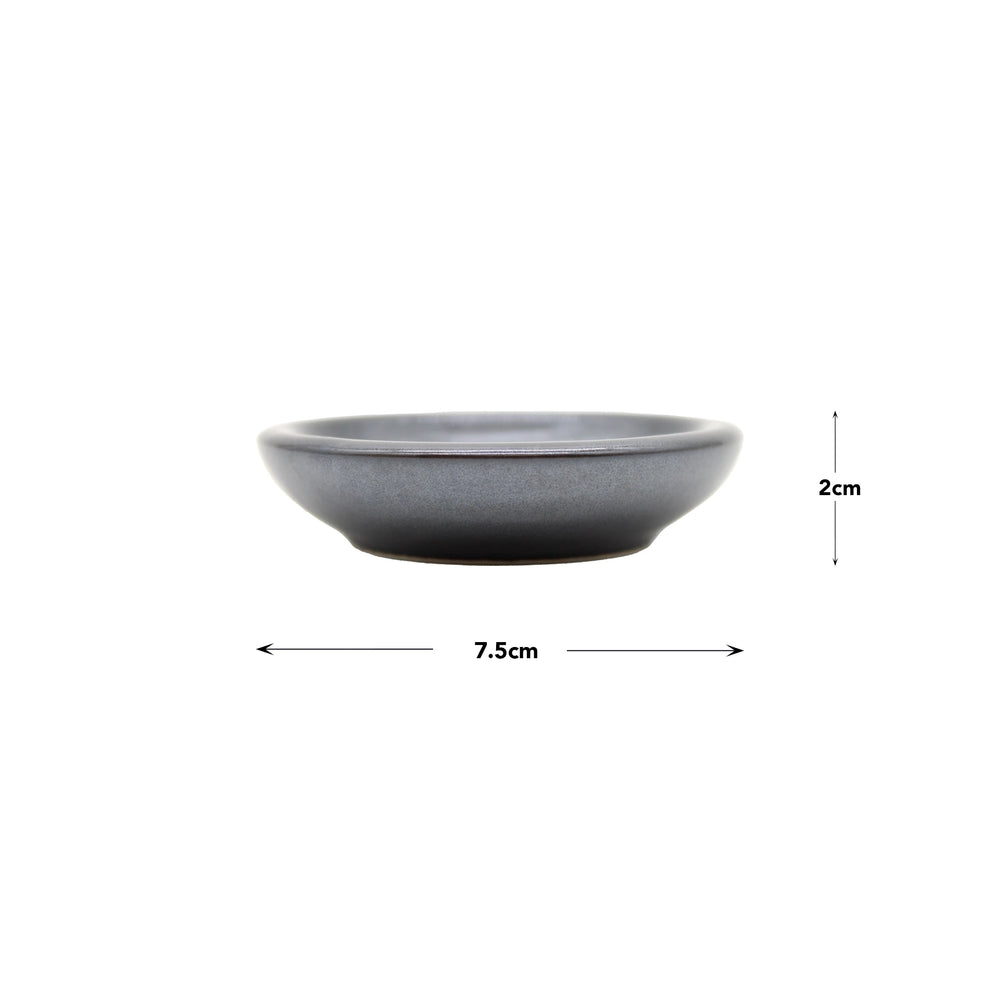 
                  
                    The Soy Sauce Dish - Black Vortex is a small, round, gray ceramic dish (7.5 cm wide, 2 cm tall), perfect for serving Japanese pickles, shown on a white background.
                  
                