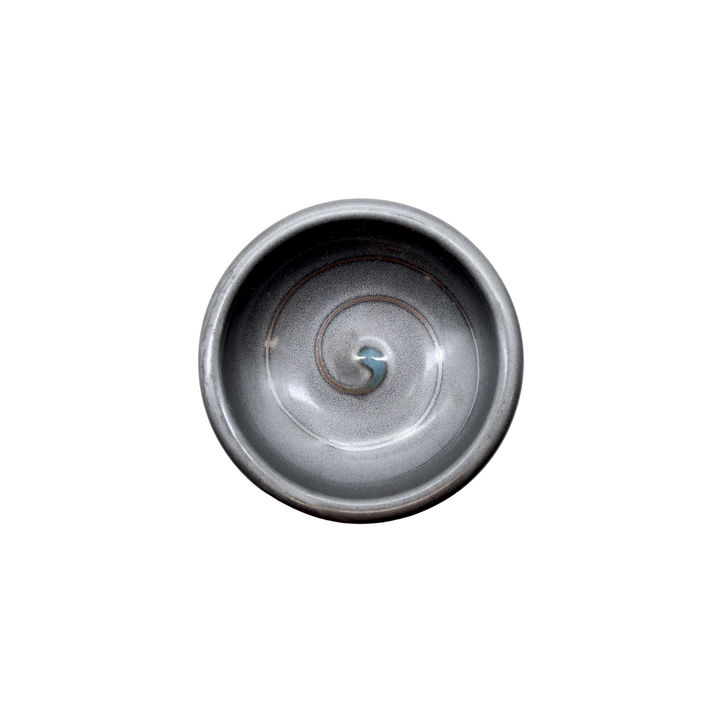 The Soy Sauce Dish - Black Vortex is a round ceramic dish with a gray spiral center, shown from above on a white background—ideal for serving Japanese pickles or condiments.