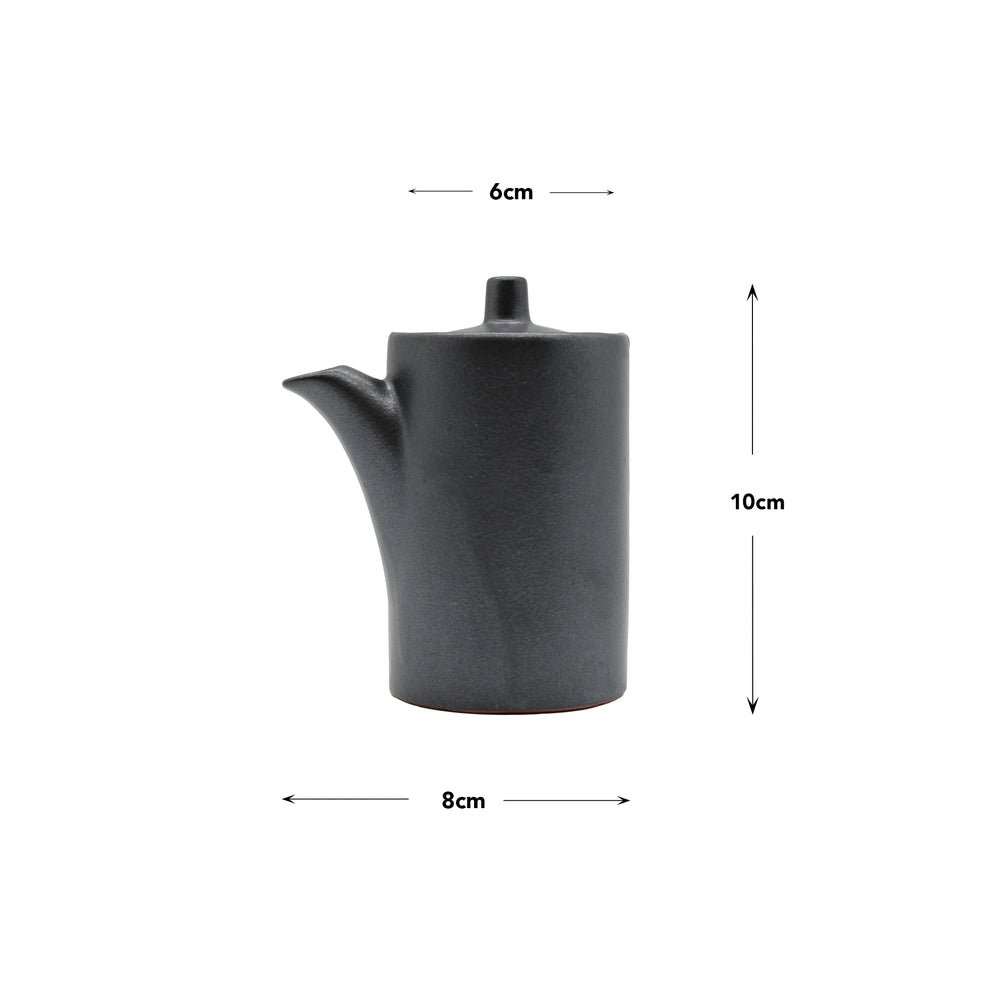 A matte black Minoyaki porcelain Soy Sauce Pourer with a spout and lid, measuring 10 cm tall, 8 cm wide at the base, and 6 cm across the top—an elegant nod to Japanese pottery traditions.