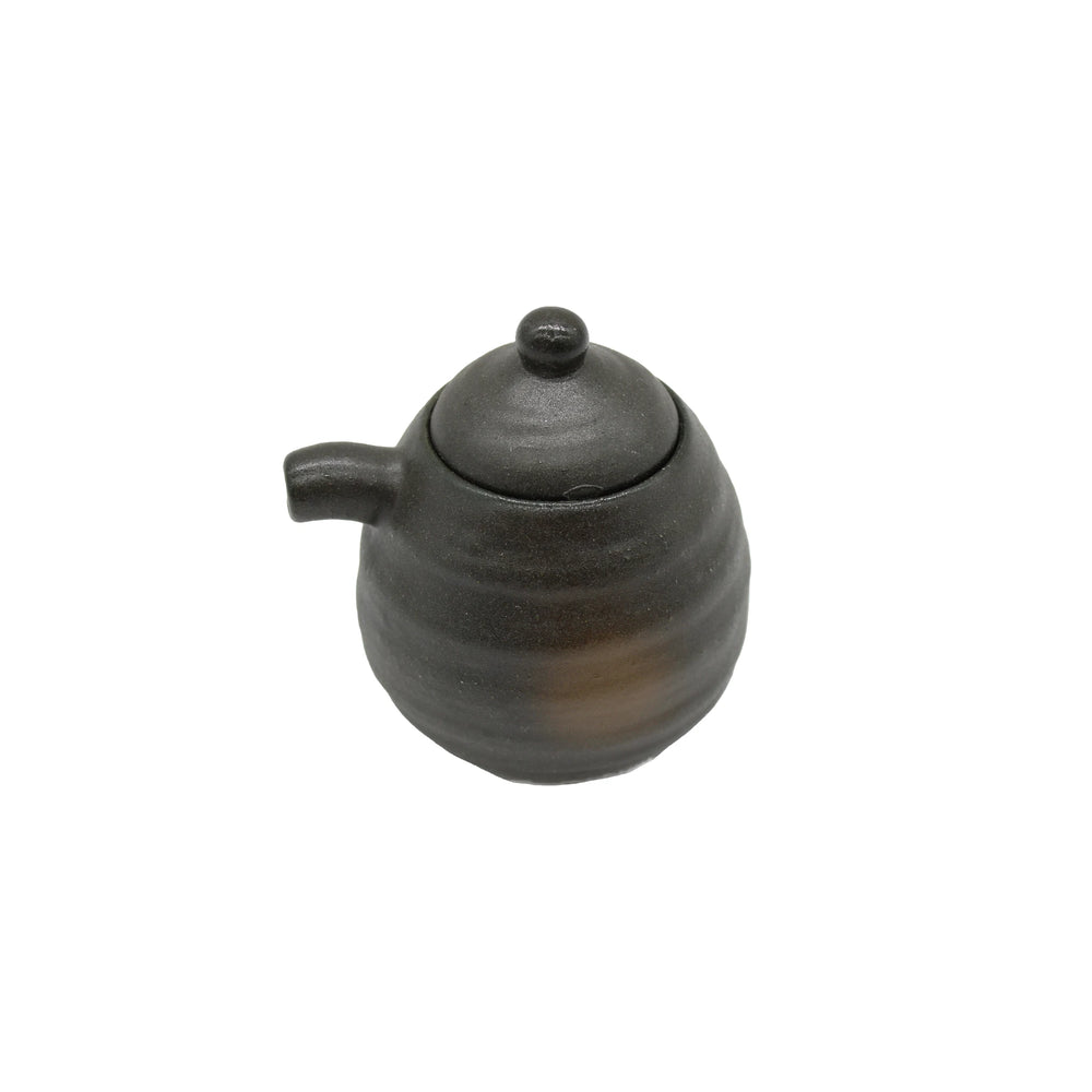 
                  
                    A small, round Soy Sauce Serving Pot - Black Bizen, featuring a short spout, lid, and matte finish, is set against a white background.
                  
                