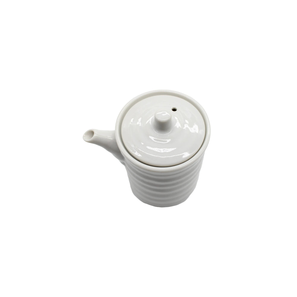 The Soy Sauce Pourer - White Ribbed features handcrafted Minoyaki porcelain with a lid and spout, shown on a plain white background—ideal for serving soy sauce elegantly or pouring your favorite condiments.
