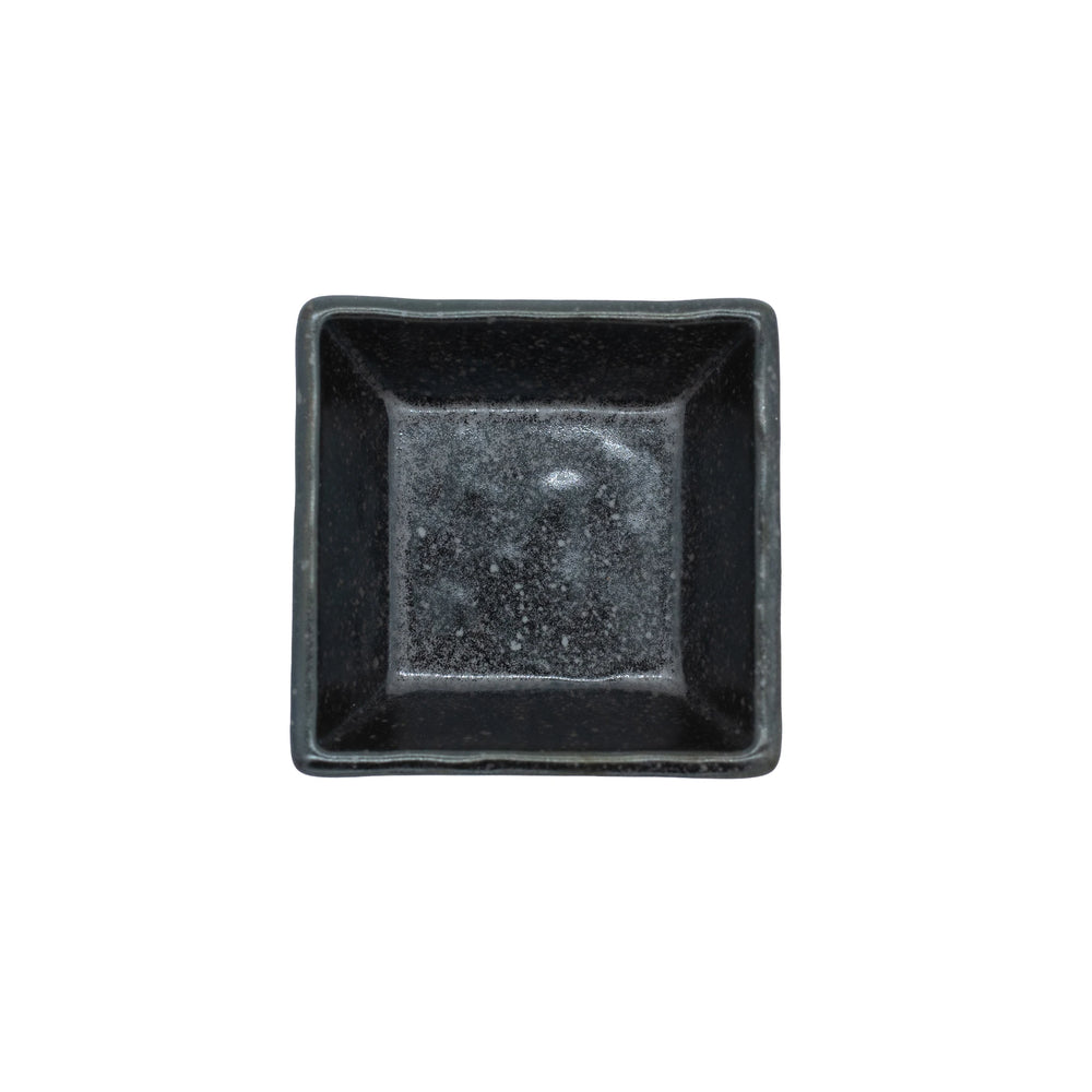 The Soy Sauce Dish - Square in Matt Black is a small, empty square dish photographed from above on a white background.