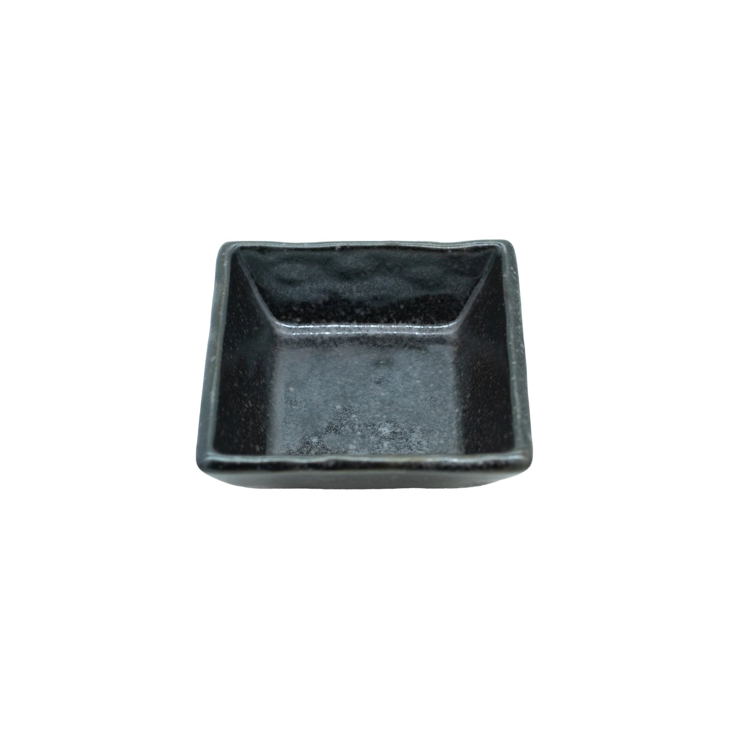 The Soy Sauce Dish - Square in Matt Black is a small, empty, square-shaped dish on a white background, ideal for serving condiments or sauces.