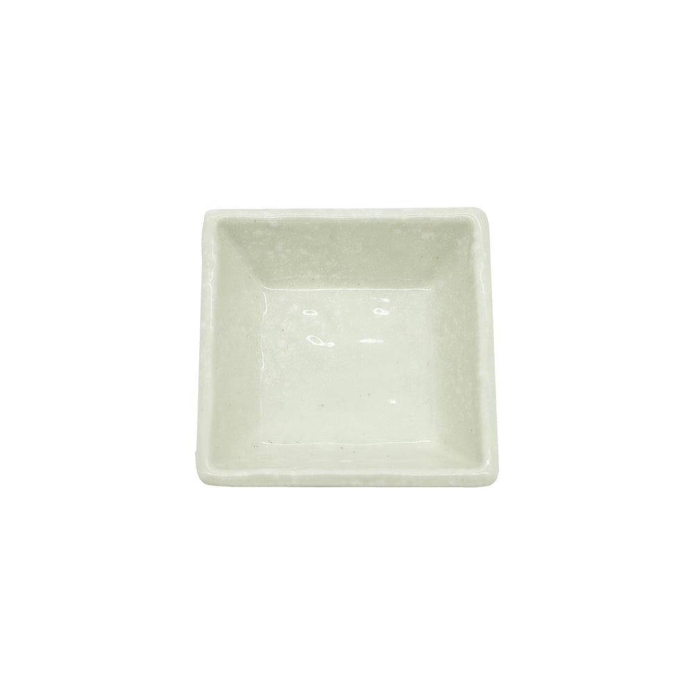 
                  
                    The Soy Sauce Dish - Square White is photographed empty on a plain white background, highlighting its simple ceramic design and capturing the essence of Japanese elegance.
                  
                