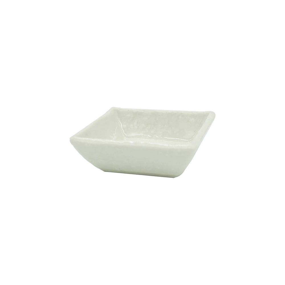 
                  
                    The Soy Sauce Dish - Square White features off-white ceramic with gently angled sides, bringing Japanese elegance to your table. Presented against a plain white background.
                  
                