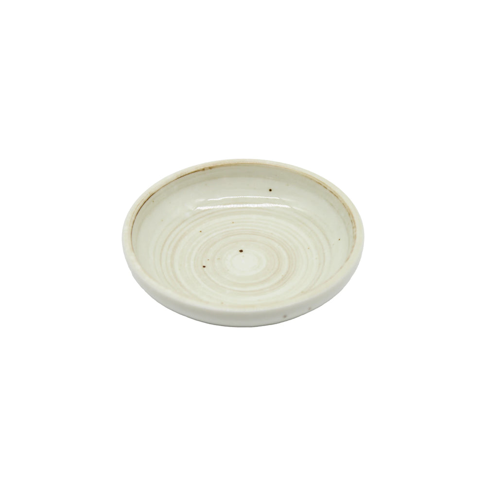 
                  
                    The Soy Sauce Dish - White Kohiki Vortex is a small, round, off-white ceramic dish with a slightly raised edge and a subtle vortex design inspired by traditional Japanese pottery.
                  
                