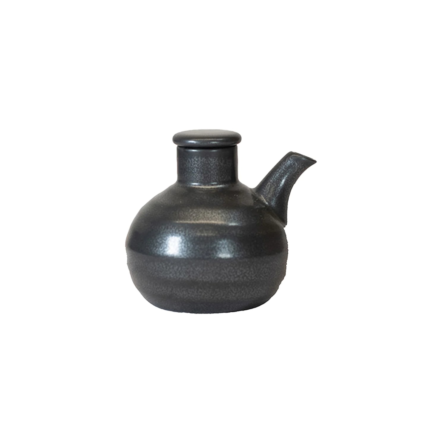 The Soy Sauce Pourer - Black Round is a small, round, matte black dispenser with a short spout and matching lid, making it a standout piece of Japanese tableware against a plain white background.