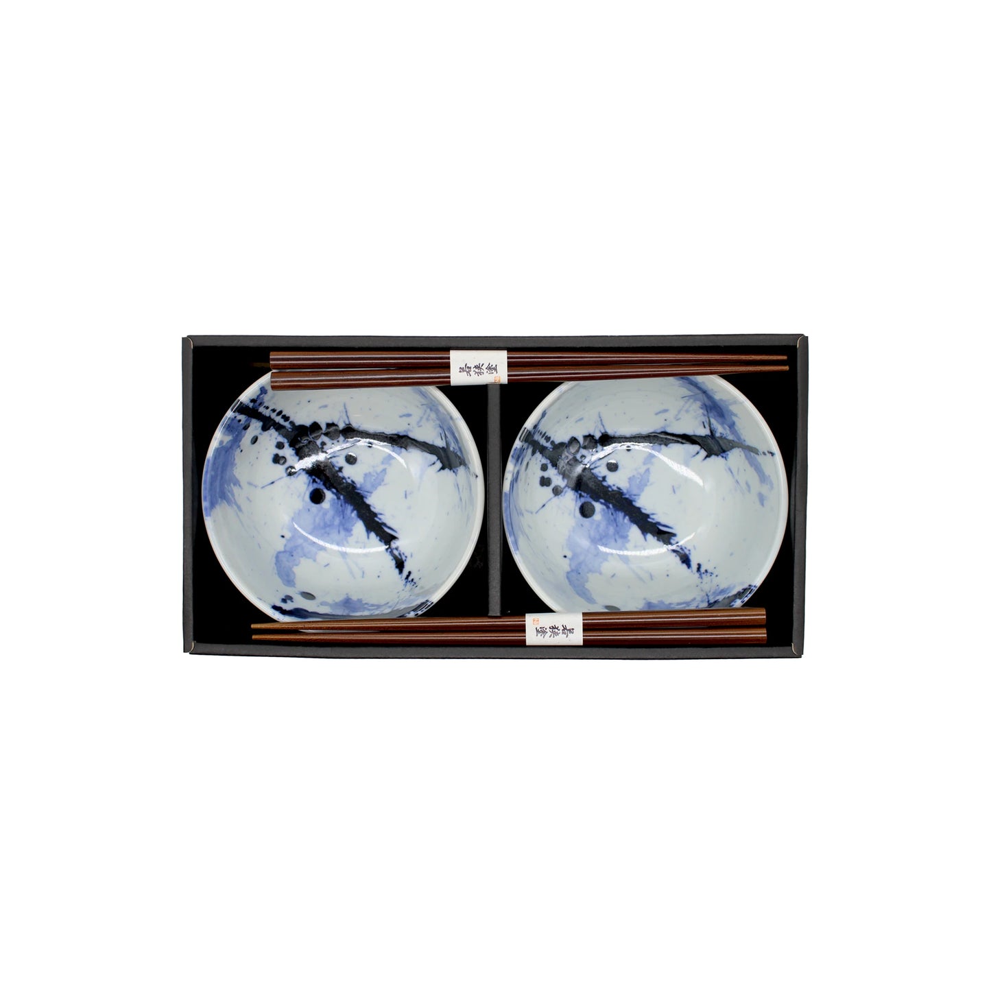 
                  
                    The Splash Design Bowls Boxed Set - Blue and White includes two handmade abstract blue-and-white bowls and two pairs of wooden chopsticks, all beautifully arranged in a sleek black tray.
                  
                
