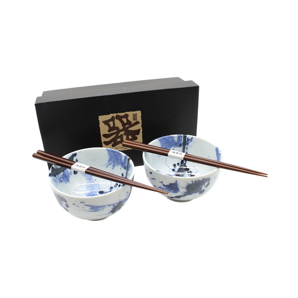 The Splash Design Bowls Boxed Set - Blue and White includes two handmade patterned bowls with chopsticks, displayed before a gift box adorned with Japanese writing and elegant design.