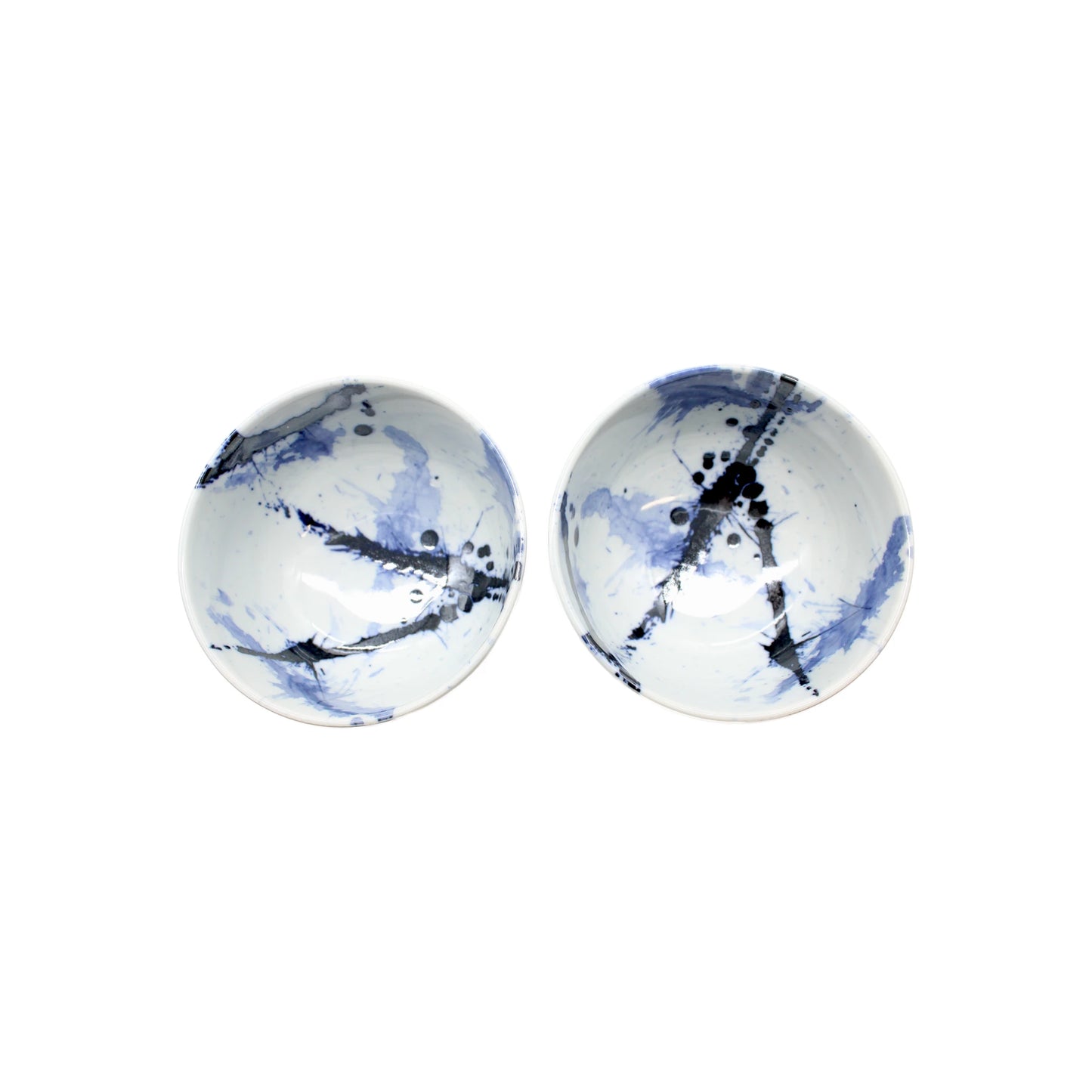 
                  
                    The Splash Design Bowls Boxed Set - Blue and White features two round ceramic bowls with white bases and blue abstract patterns, inspired by Japanese design, displayed side by side on a plain white background.
                  
                