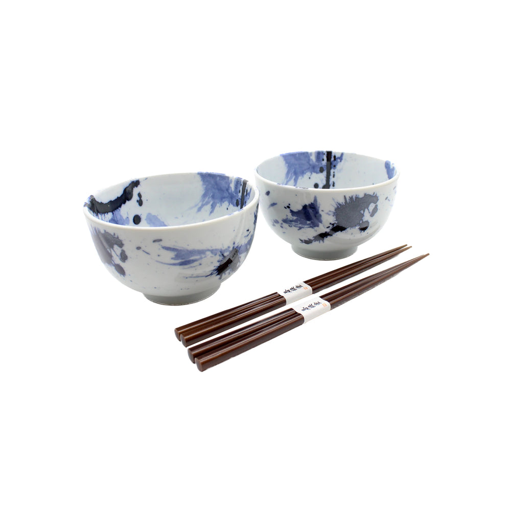 
                  
                    The Splash Design Bowls Boxed Set - Blue and White features two handmade blue-splatter bowls and two pairs of wooden chopsticks, inspired by Japanese design, arranged against a white background.
                  
                