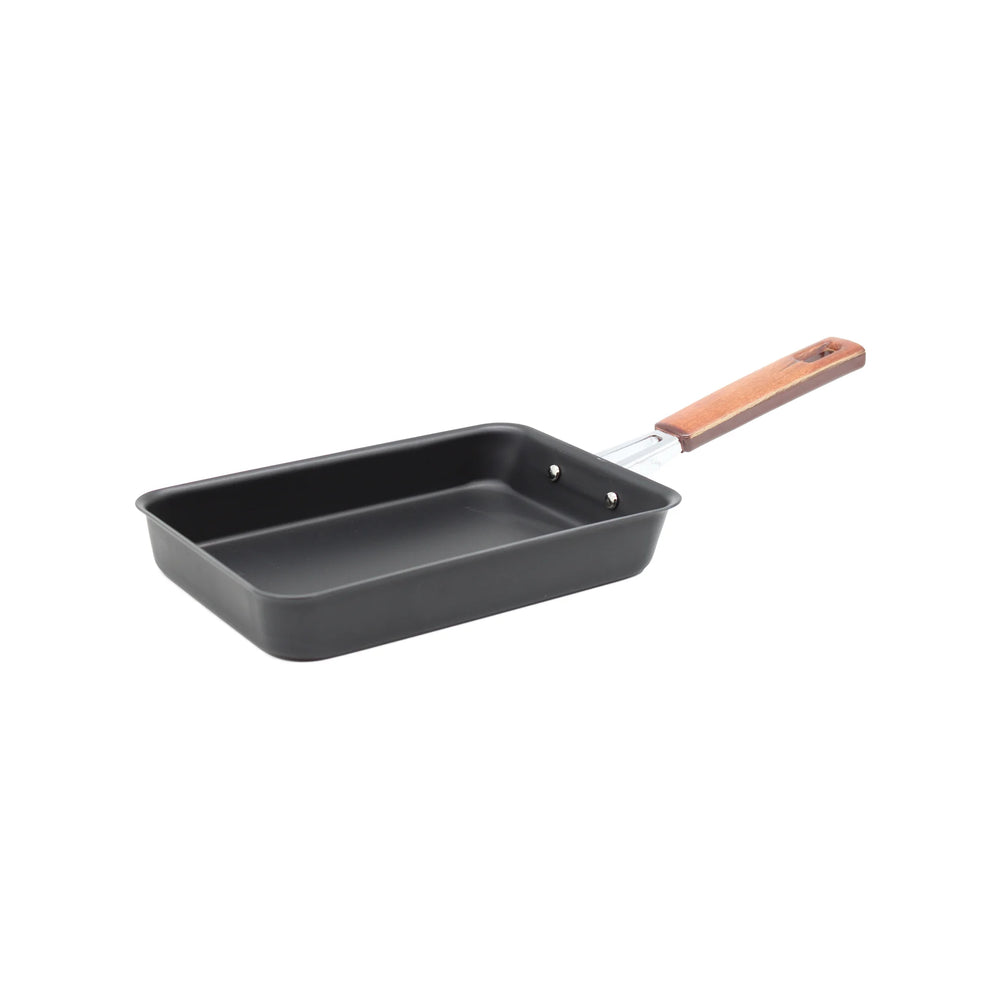 The Tamagoyaki Omelette Pan 19cm features a rectangular black non-stick design, metal riveted handle, and wooden grip—ideal for making Japanese omelettes. Isolated on a white background.