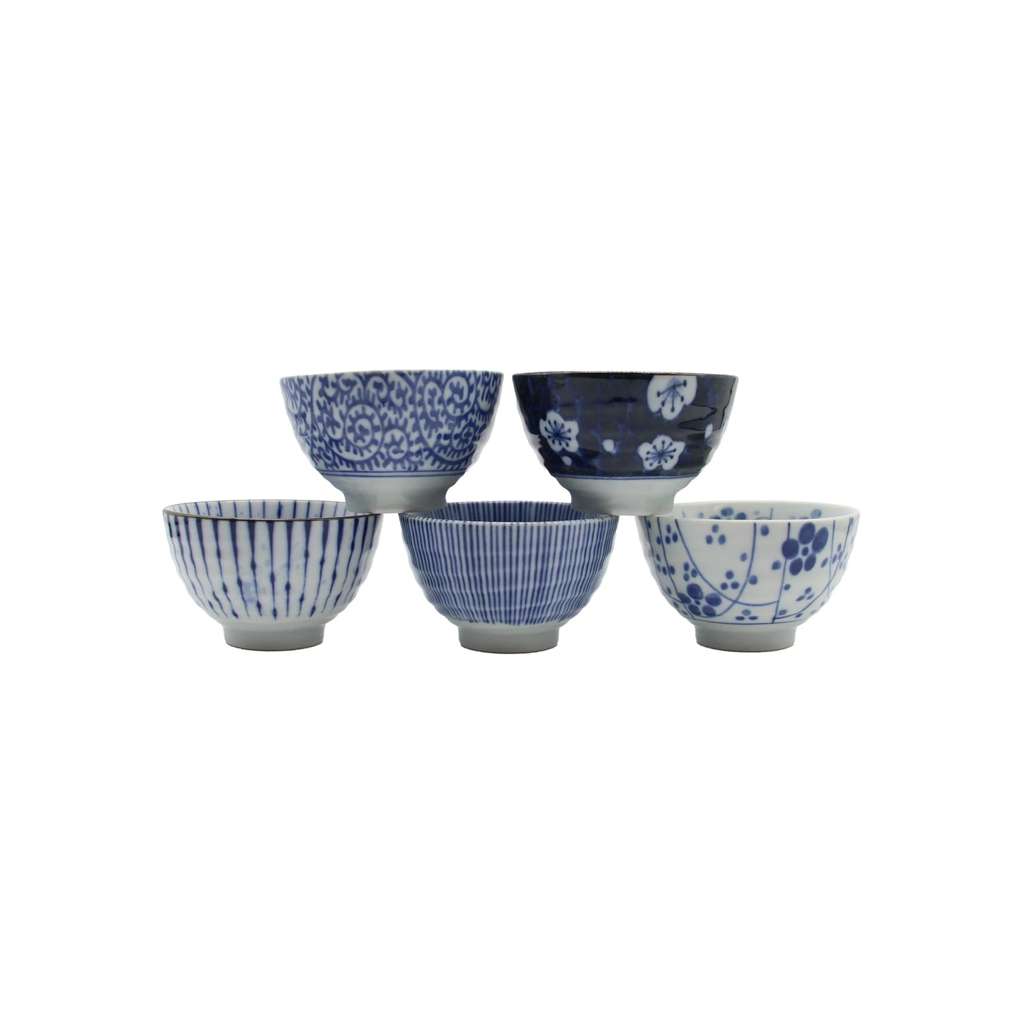 
                  
                    Five small Japanese ceramic teacups from the 5 Piece Japanese Teacup Gift Set - Aizome arranged in a pyramid, each decorated with distinct indigo blue and white patterns.
                  
                