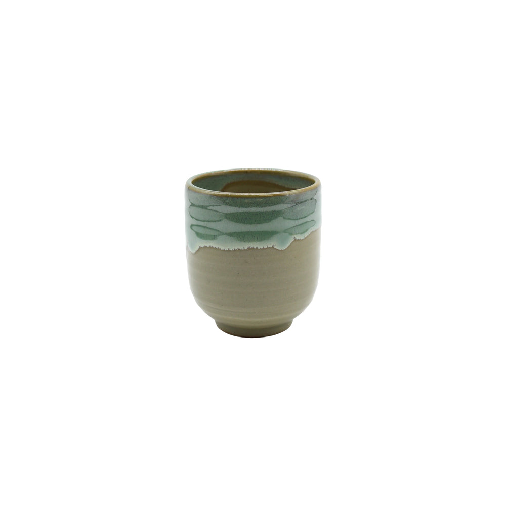 The Tea Mug - Aqua Drip features Japanese craftsmanship with a beige base and light green glazed rim, beautifully displayed against a white background.