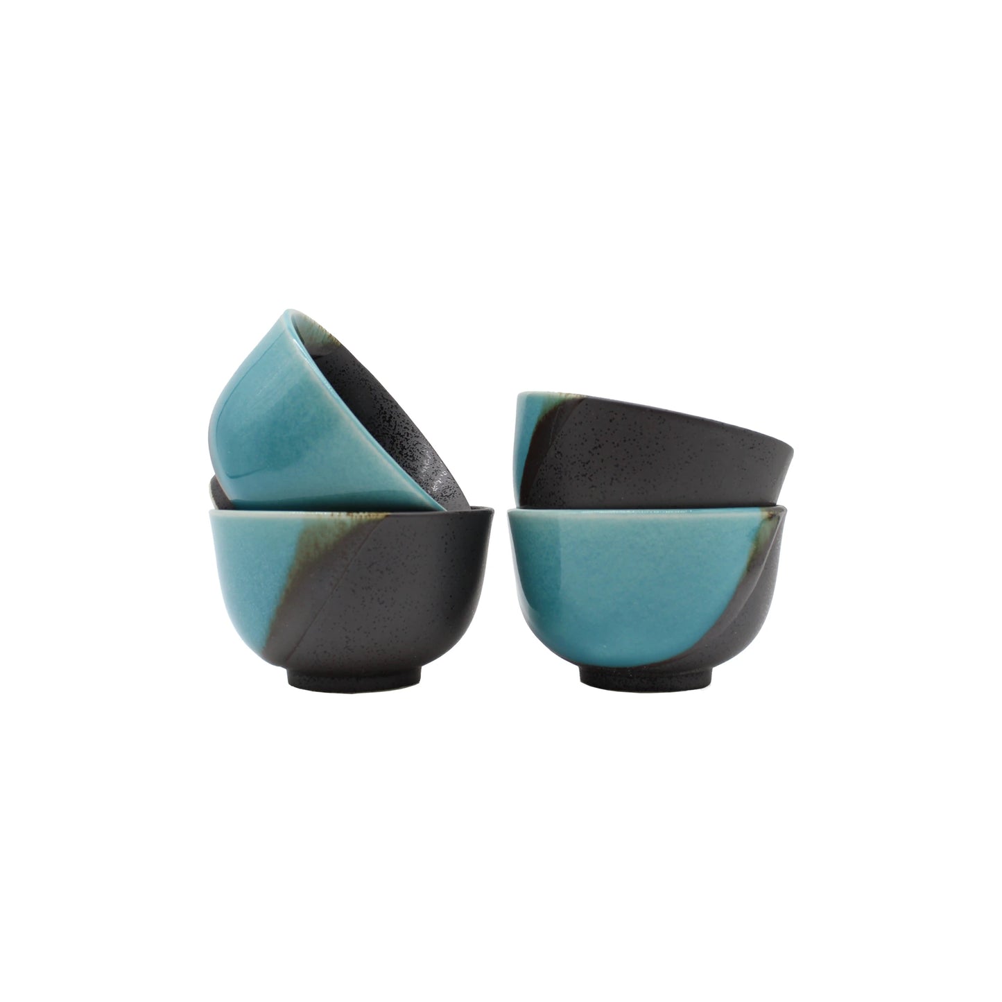 
                  
                    The Tea Gift Set for Four features ceramic bowls with sky blue and grey glaze, inspired by Japanese craftsmanship, stacked together against a white background.
                  
                