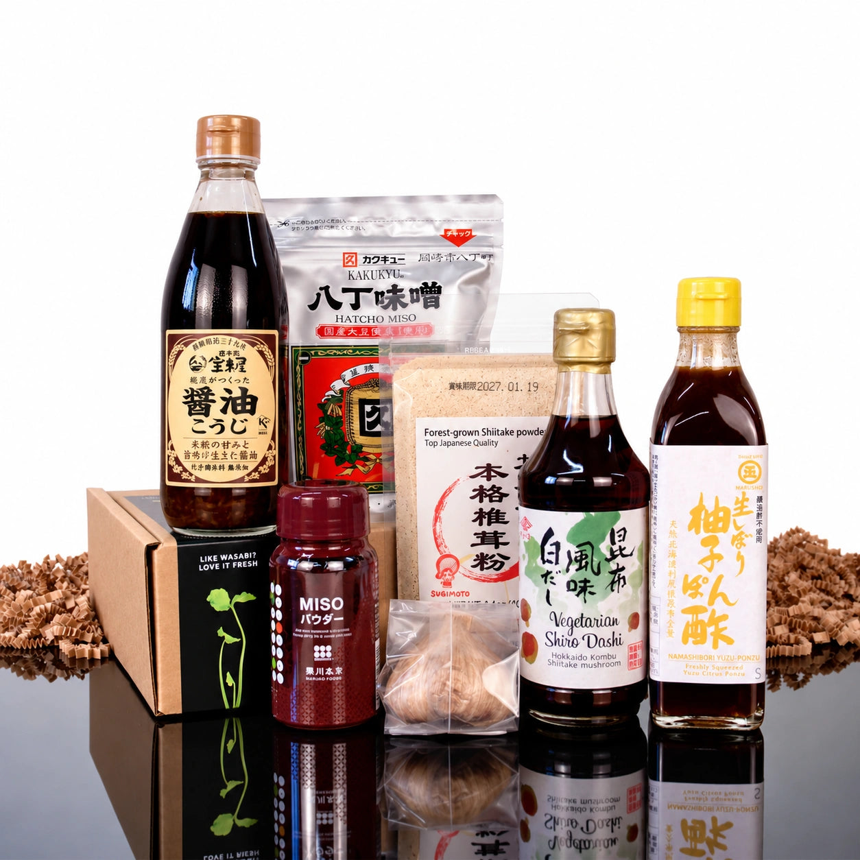The Japanese Umami Box featuring soy sauce, dashi, yuzu-ponzu, hatcho miso, miso powder, and dried shiitake mushrooms.