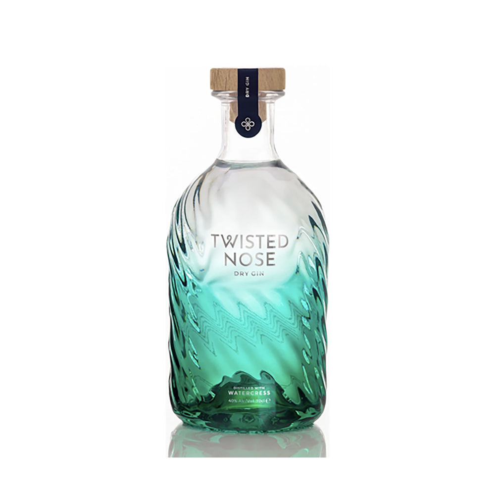 A clear glass 70cl bottle of Watercress Gin from Winchester Distillery, featuring a wooden cap and a green-tinted, textured spiral design that highlights this craft gin’s unique character.