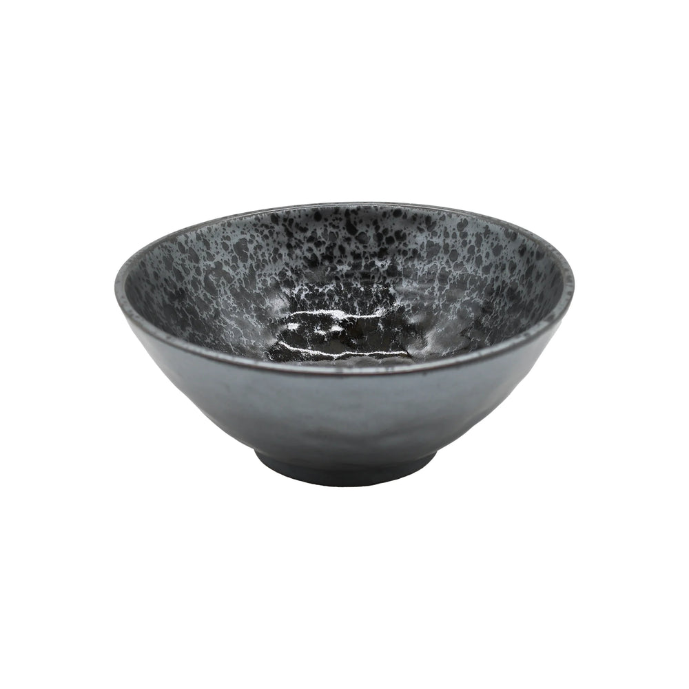 The Udon Bowl - Black Pearl is a dark, speckled Minoyaki porcelain piece with a round base and wide rim, finished in black pearl glaze—an eye-catching decorative item for any space.