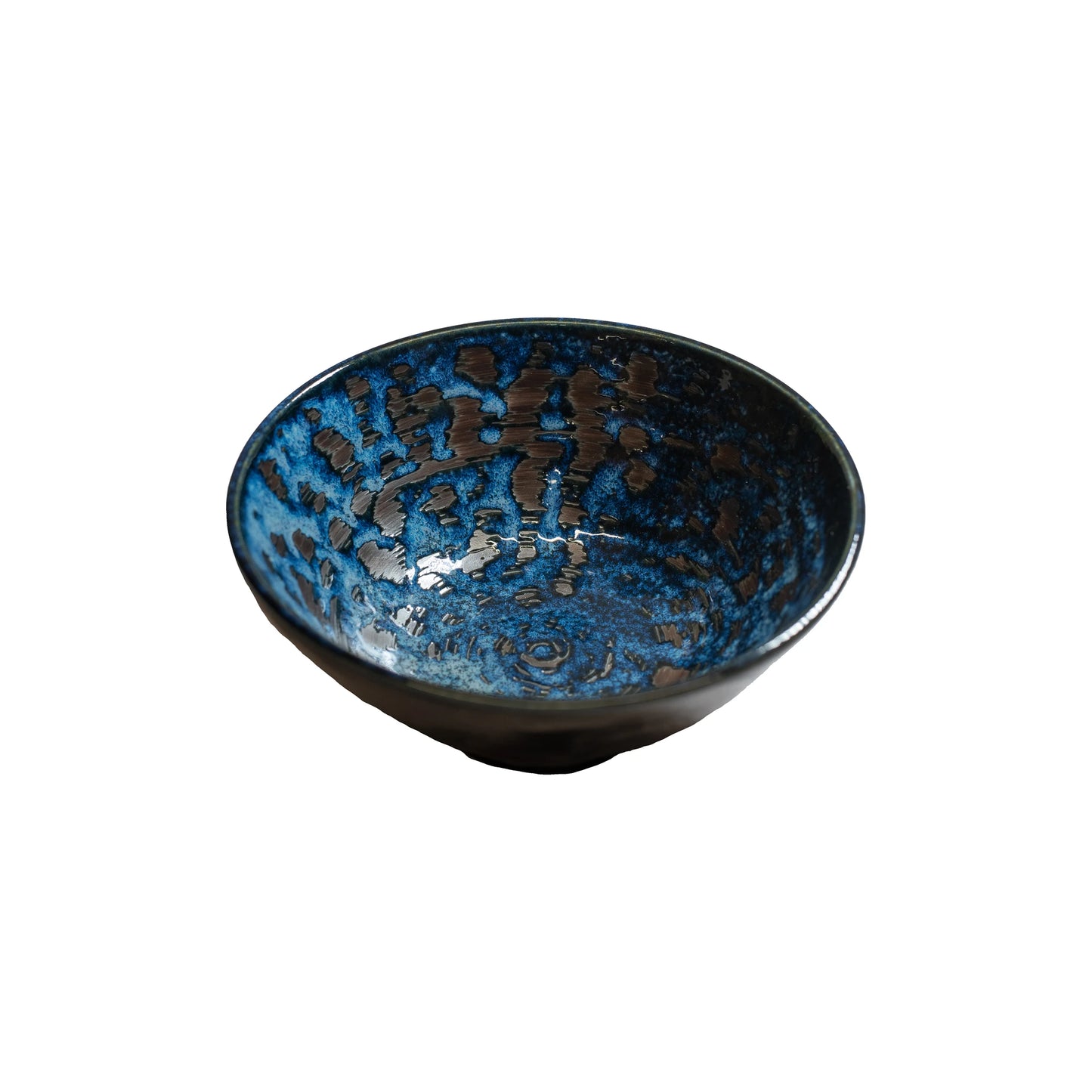 The Udon Bowl - Copper Swirl features a rounded shape with a slightly flared rim and is crafted from Minoyaki porcelain, showcasing a striking blue and black glazed pattern on a white background.