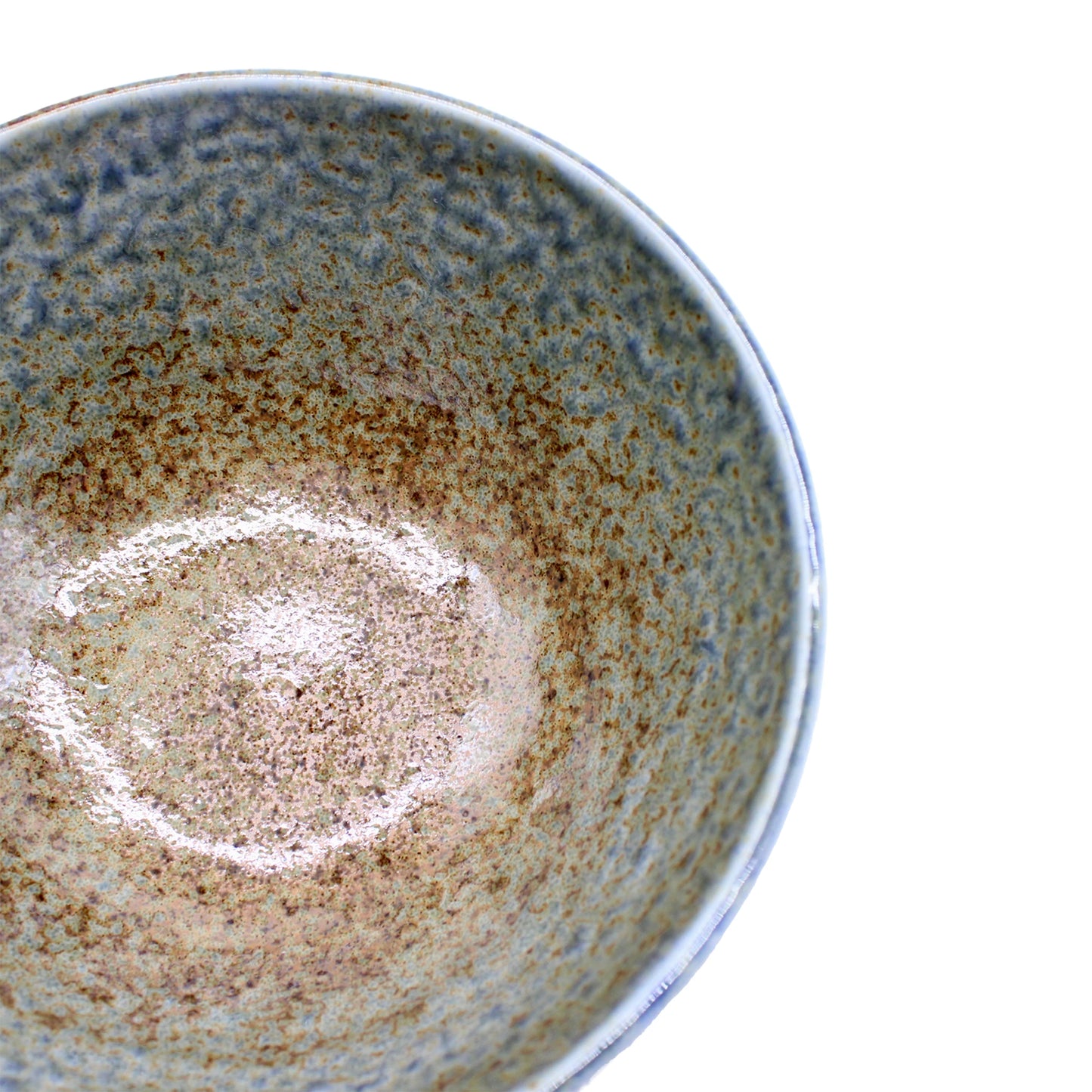 
                  
                    Close-up of the Udon Bowl - Earth & Sky, featuring a speckled brown and blue glaze, highlighting its inner surface and rim against a white background.
                  
                