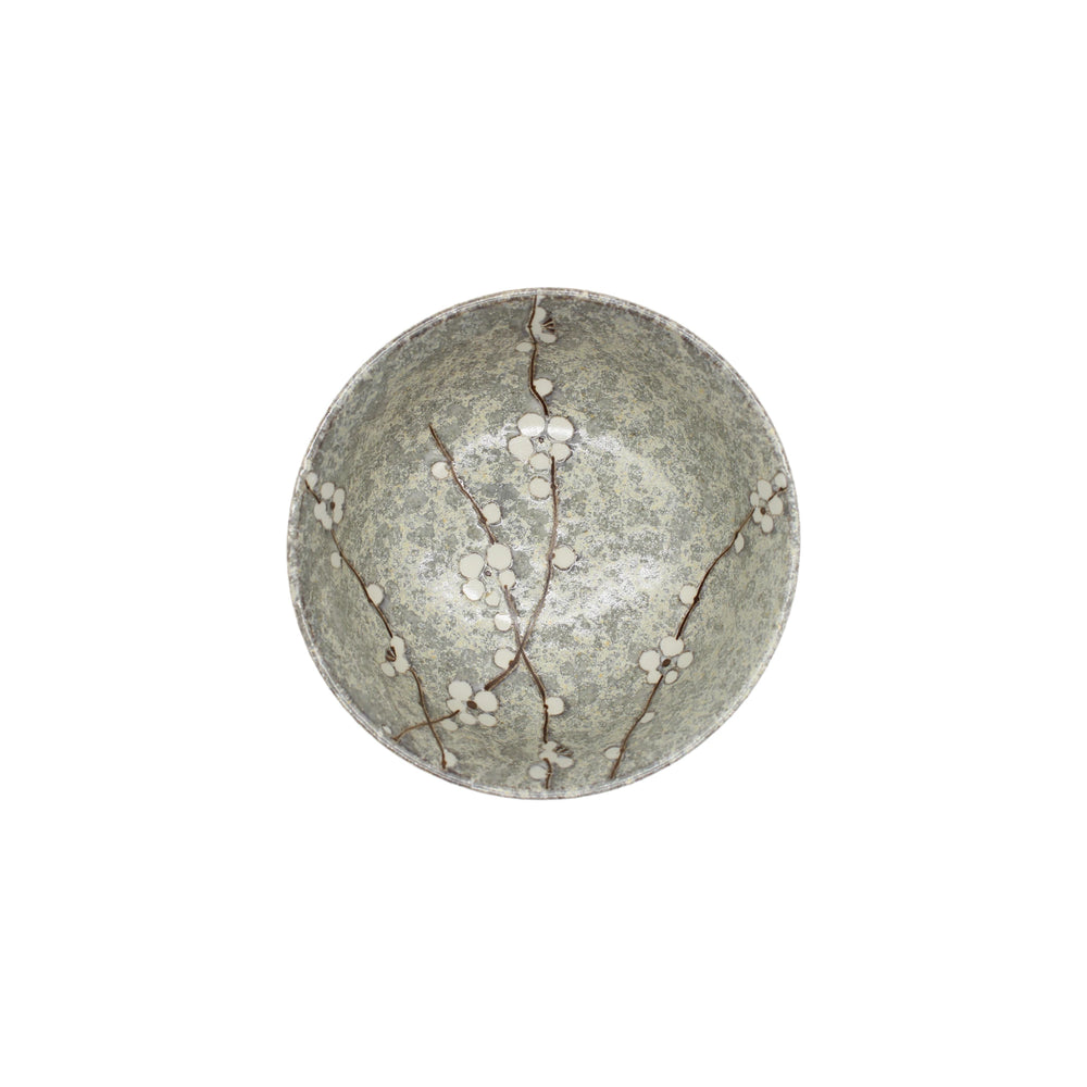 
                  
                    The Udon Bowl - Grey Cherry Blossom is a round ceramic bowl with a mottled gray-green interior, adorned with delicate white cherry blossoms and brown branches inspired by Japanese art motifs.
                  
                