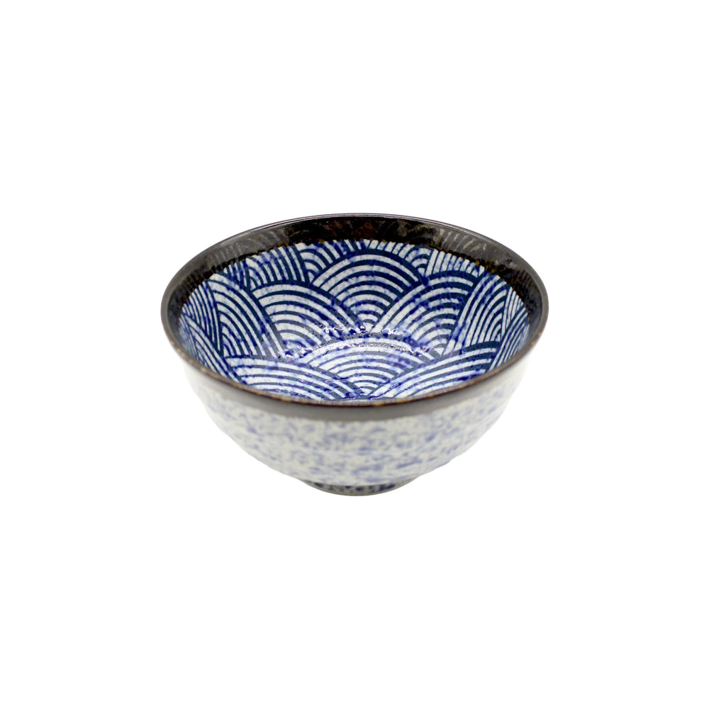 The Udon Bowl - Japanese Wave is a Japanese ceramic bowl with a striking blue seigaiha pattern inside and a dark rim, photographed against a white background.