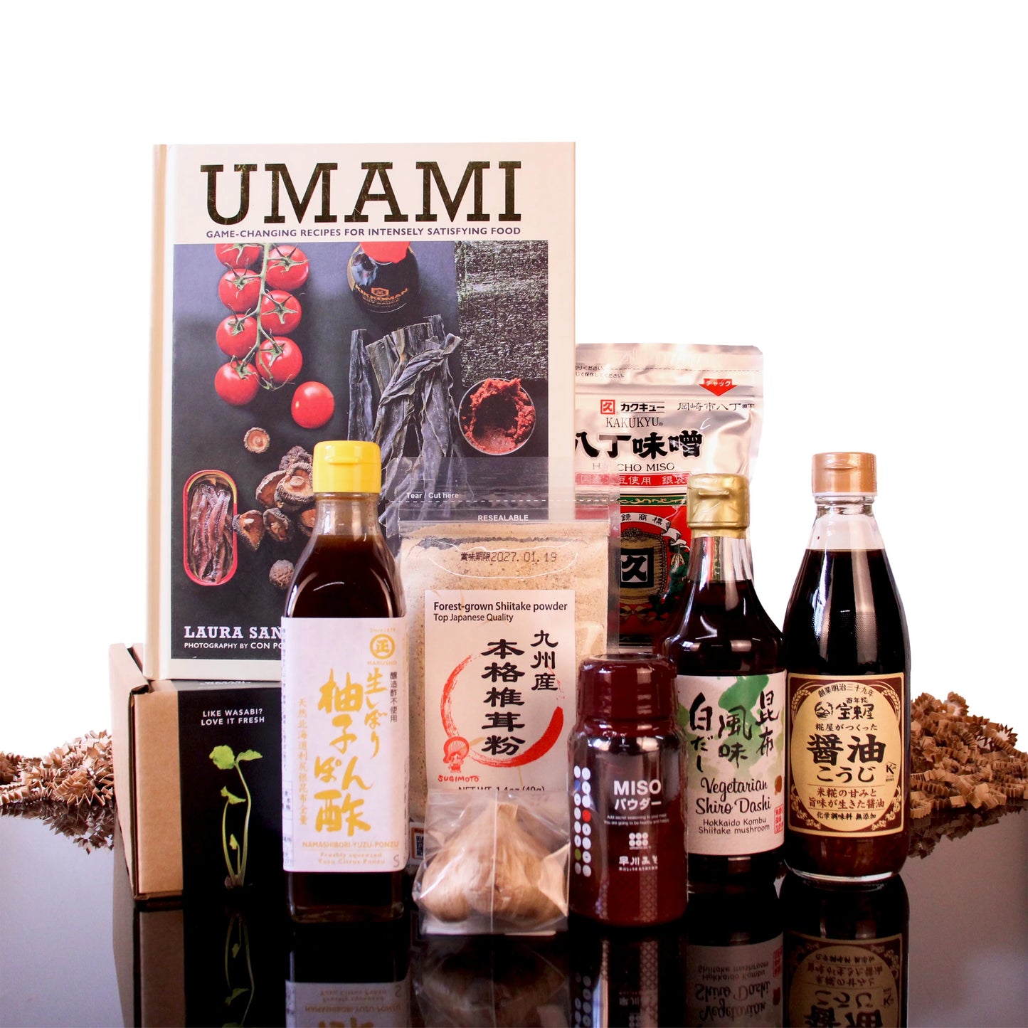 The Japanese Umami Box With Umami Cook Book, featuring ponzu, dashi, soy sauce, shiitake powder, and miso.