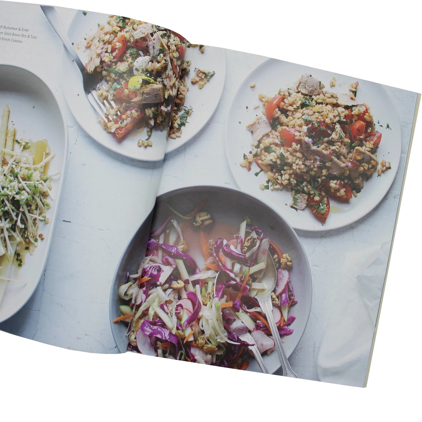 
                  
                    An overhead view of three vegetable and grain salads served from the Umami by Laura Santini cookbook.
                  
                