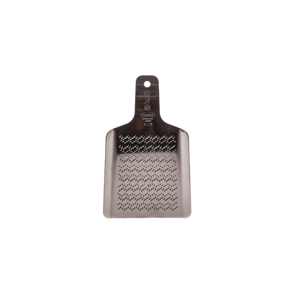 The Wasabi Stainless Steel Grater - Small is a rectangular grater with a handle and fine holes, made of stainless steel and shown on a white background.