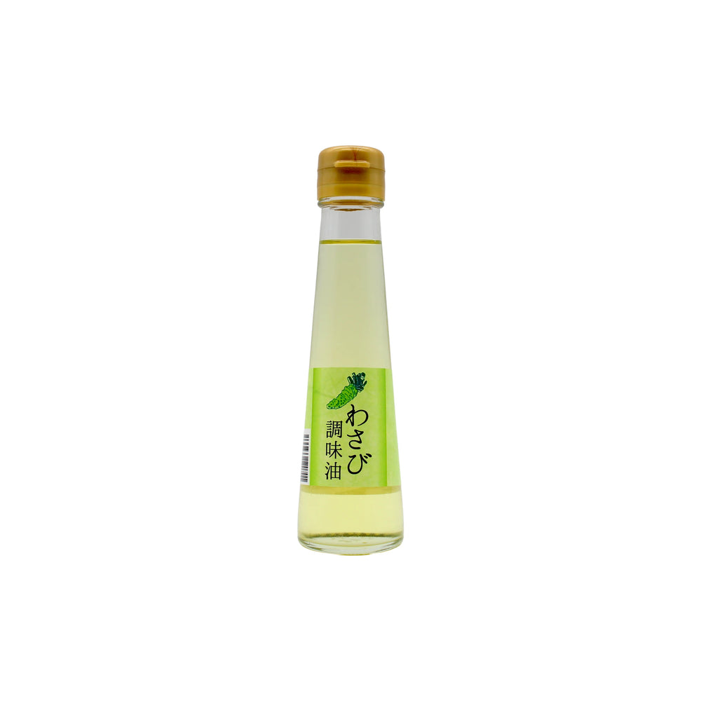 Wasabi Oil 100ml: A clear glass bottle with a yellow cap and vibrant green-yellow Japanese label, offering premium wasabi oil with a unique flavour for adventurous palates.