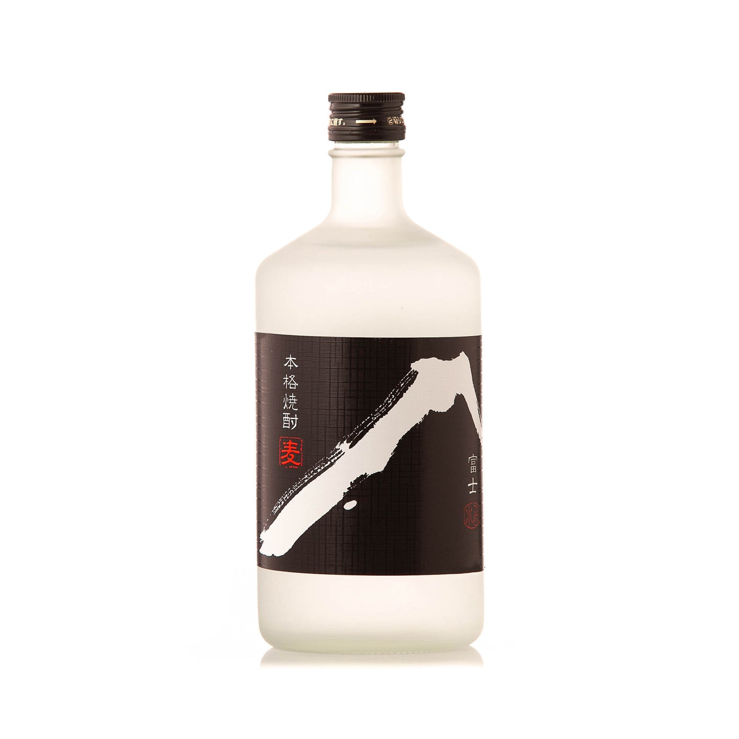 A clear glass bottle of White Fuji Barley Shochu (720ml) with a black label featuring white and red Japanese characters and an abstract design, filled with transparent barley shochu made using pure Mount Rokko water.