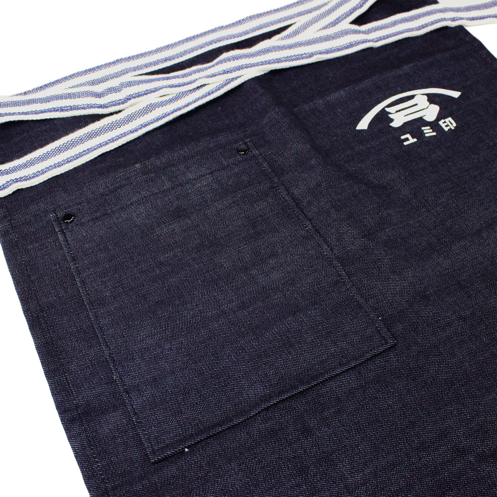 
                  
                    The Yugeta Shoyu Apron is a dark denim kitchen apron with a large front pocket, white logo, Japanese characters above the pocket, and a striped waistband—blending Japanese heritage and modern style for any kitchen.
                  
                